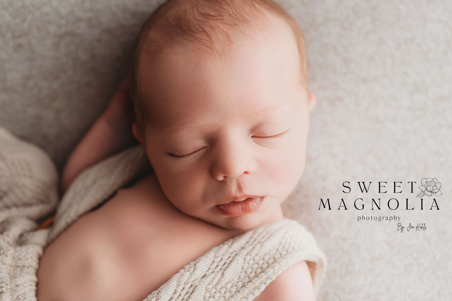 Peaceful newborn photography series showing soft white swaddle and delicate details.