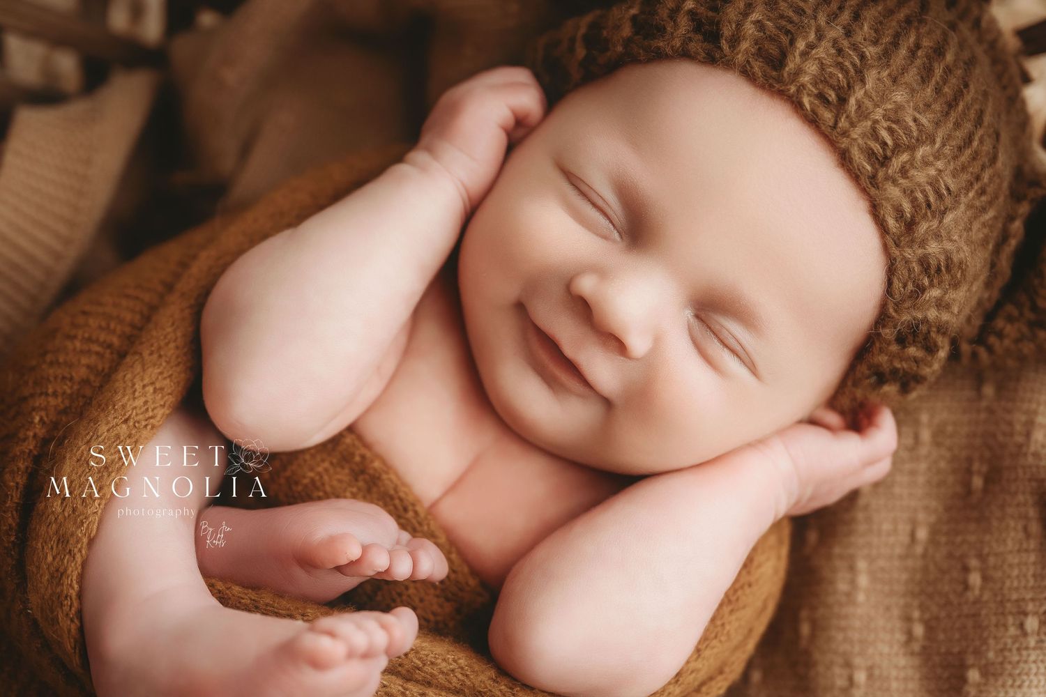 Peaceful sleeping newborn photos with brown knit textures and neutral tones.