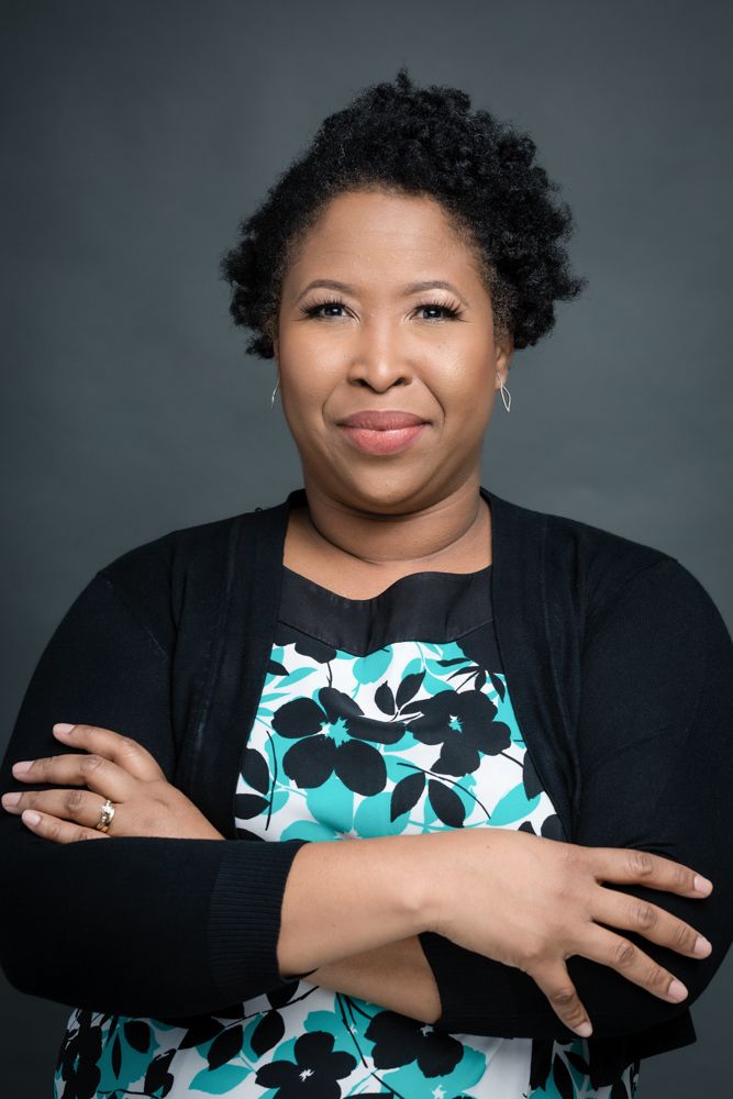 A series of five professional studio portraits showing someone wearing a black cardigan over a turquoise and white patterned dress.