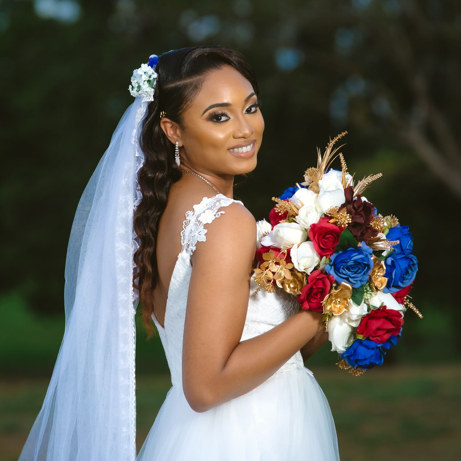 Beautiful bridal portrait featuring patriotic red, white and blue floral bouquet.