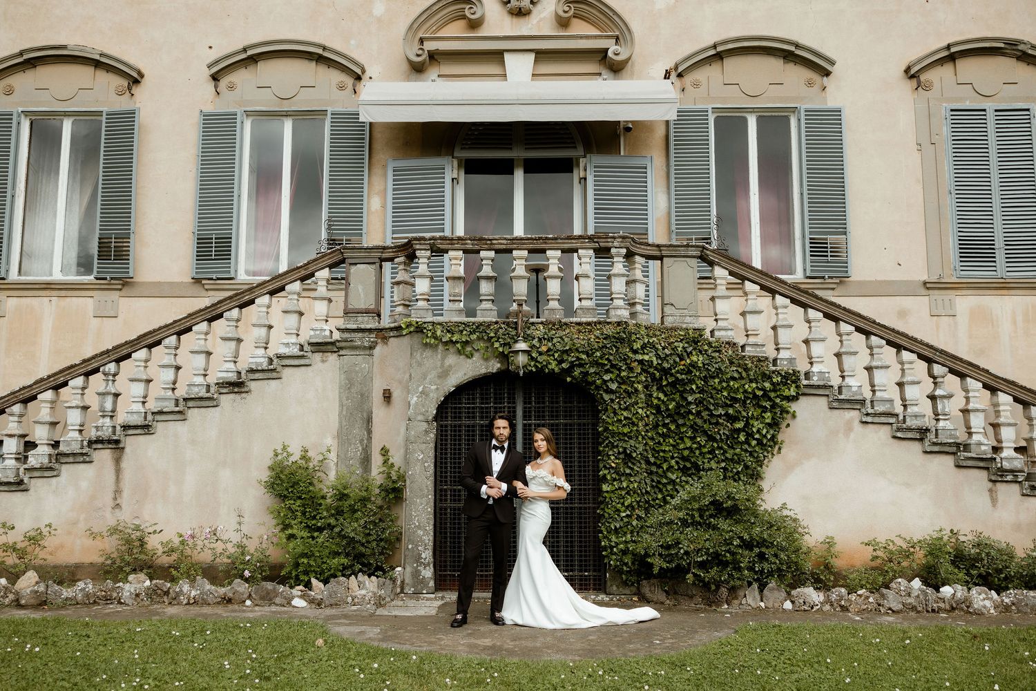 A series of wedding photos showing couples in formal attire posing on elegant curved stone staircases at a historic venue.