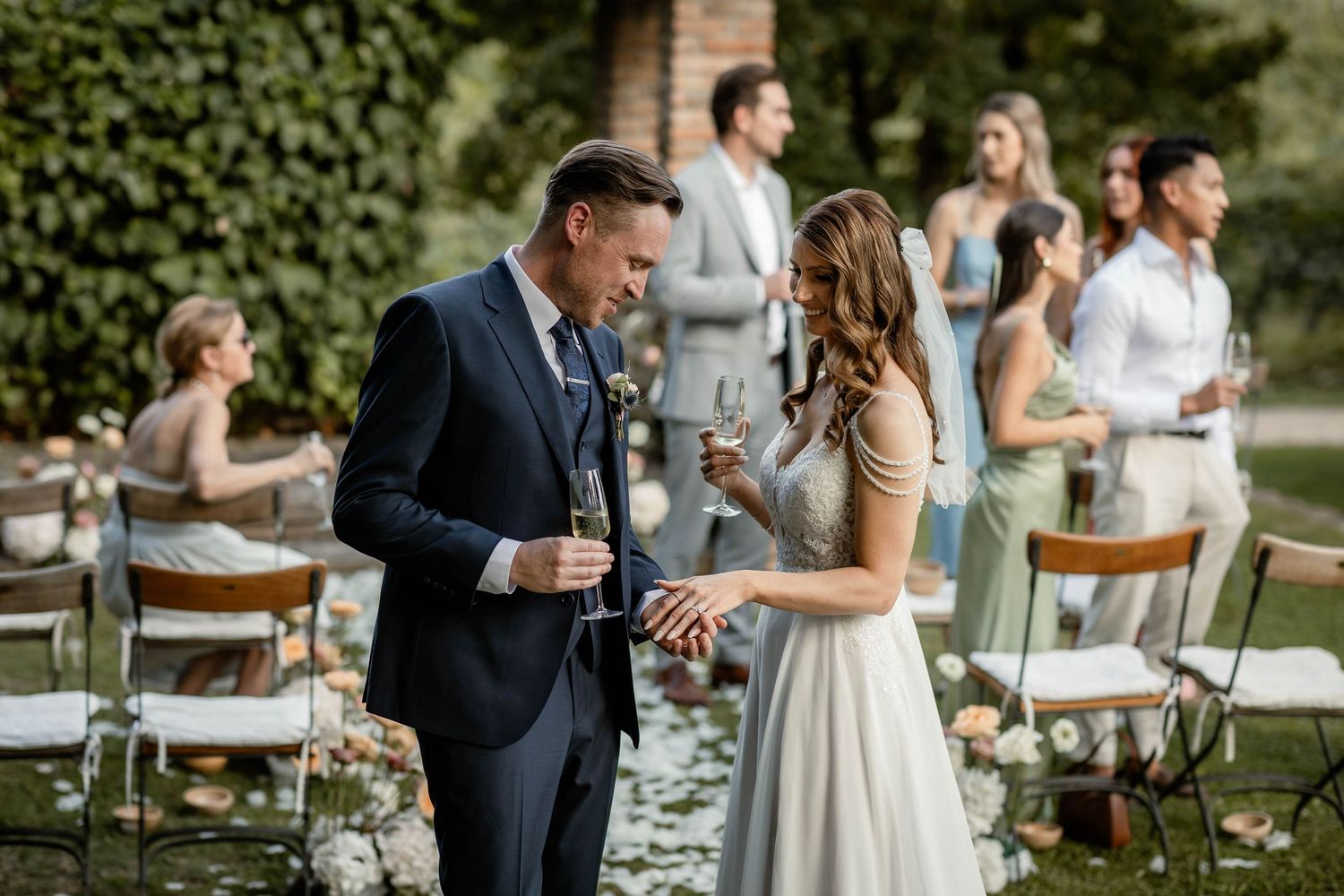 Happy couple sharing a moment during their outdoor garden wedding reception.