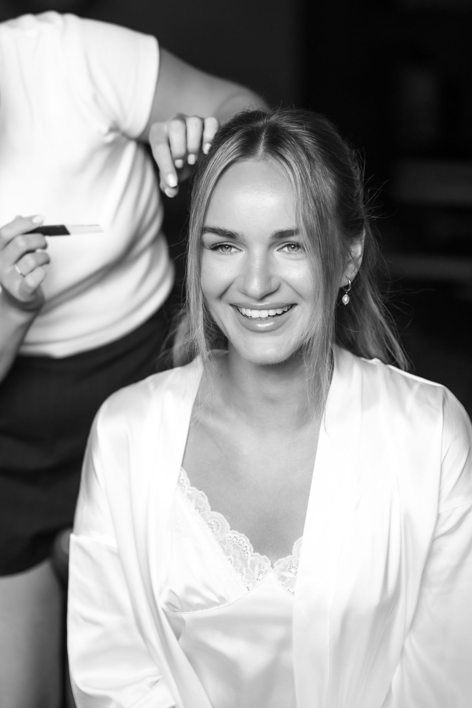 A series of black and white close-up photos showing joyful expressions and genuine laughter.