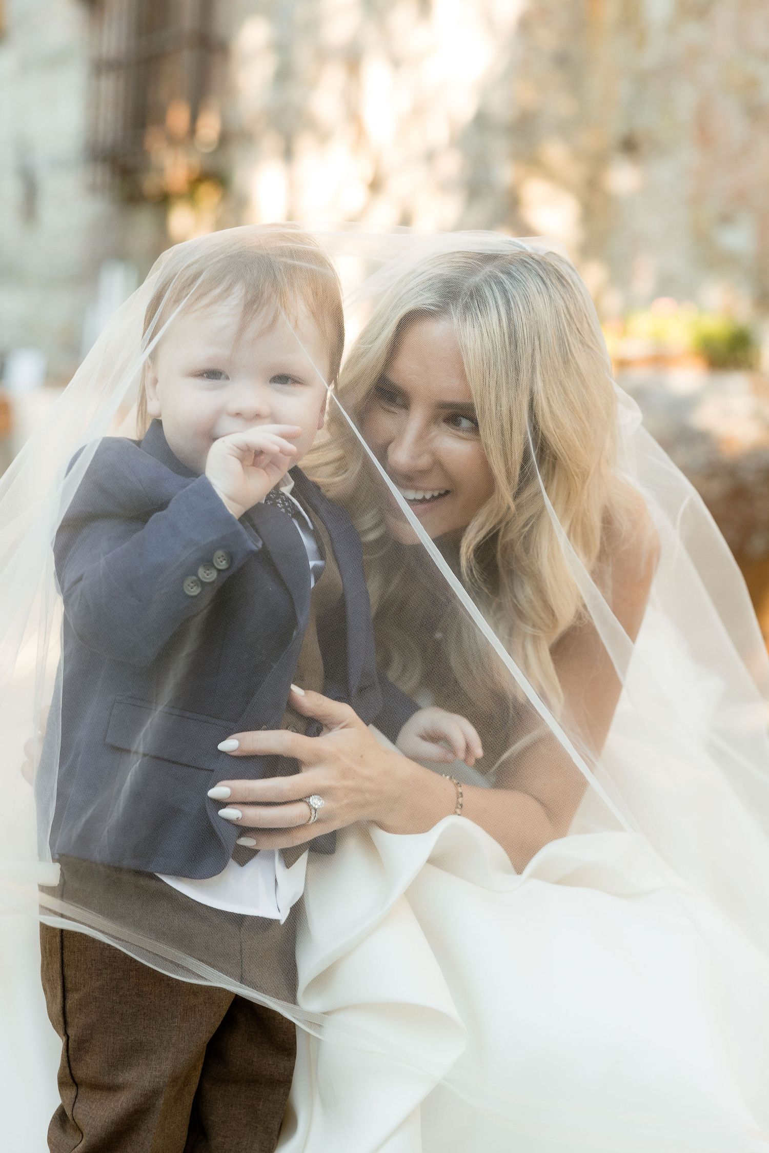 A tender moment between a bride and child captured in a series of candid wedding photos with soft natural lighting.