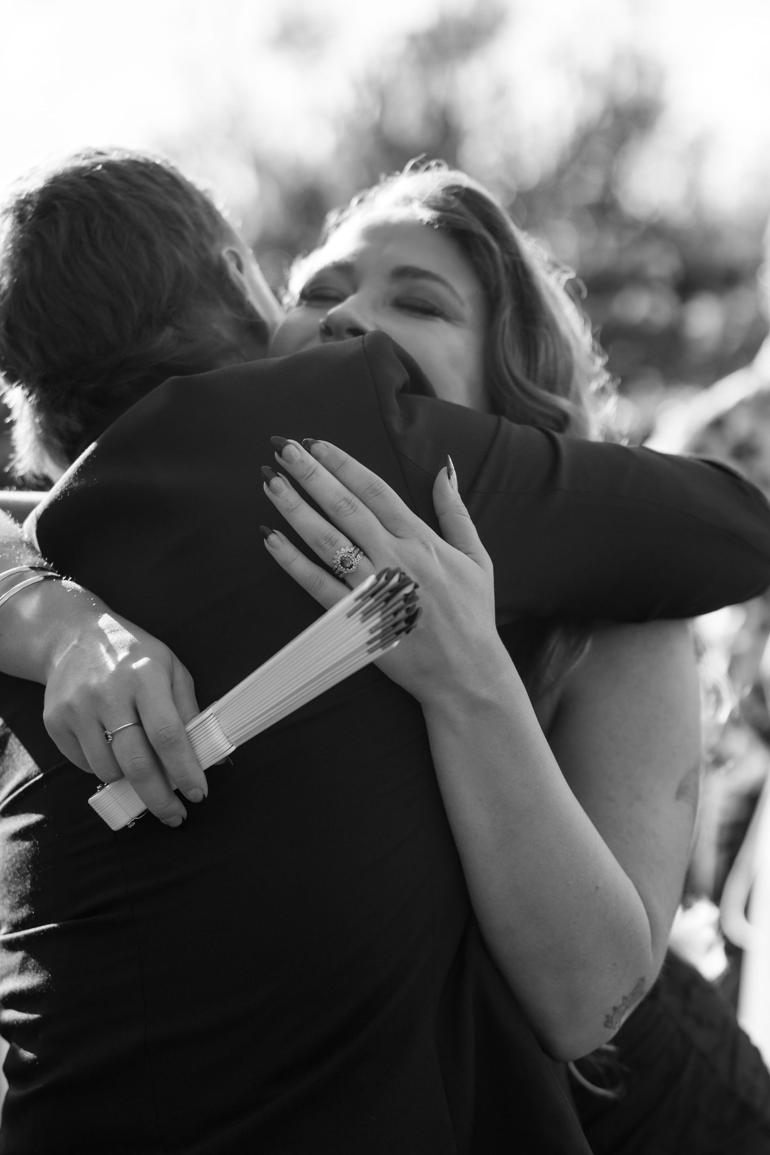 Black and white photo sequence showing hands covering faces in an emotional moment.