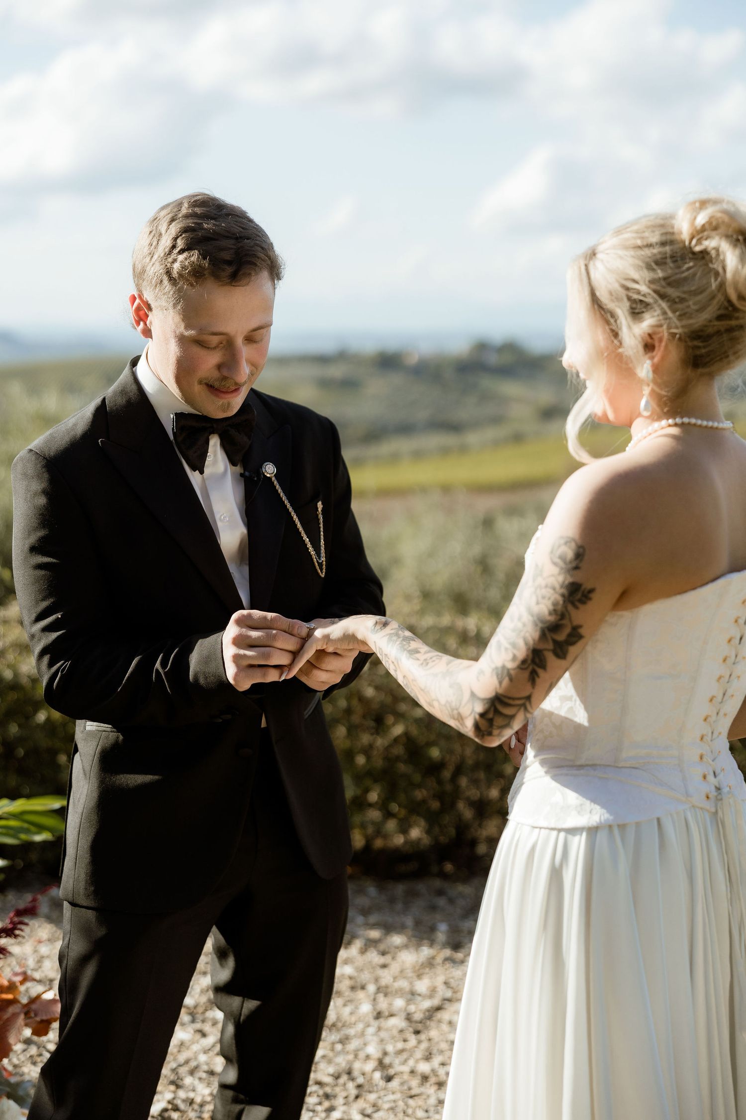 A series of romantic wedding photos shows a couple exchanging rings during an outdoor ceremony with scenic views.