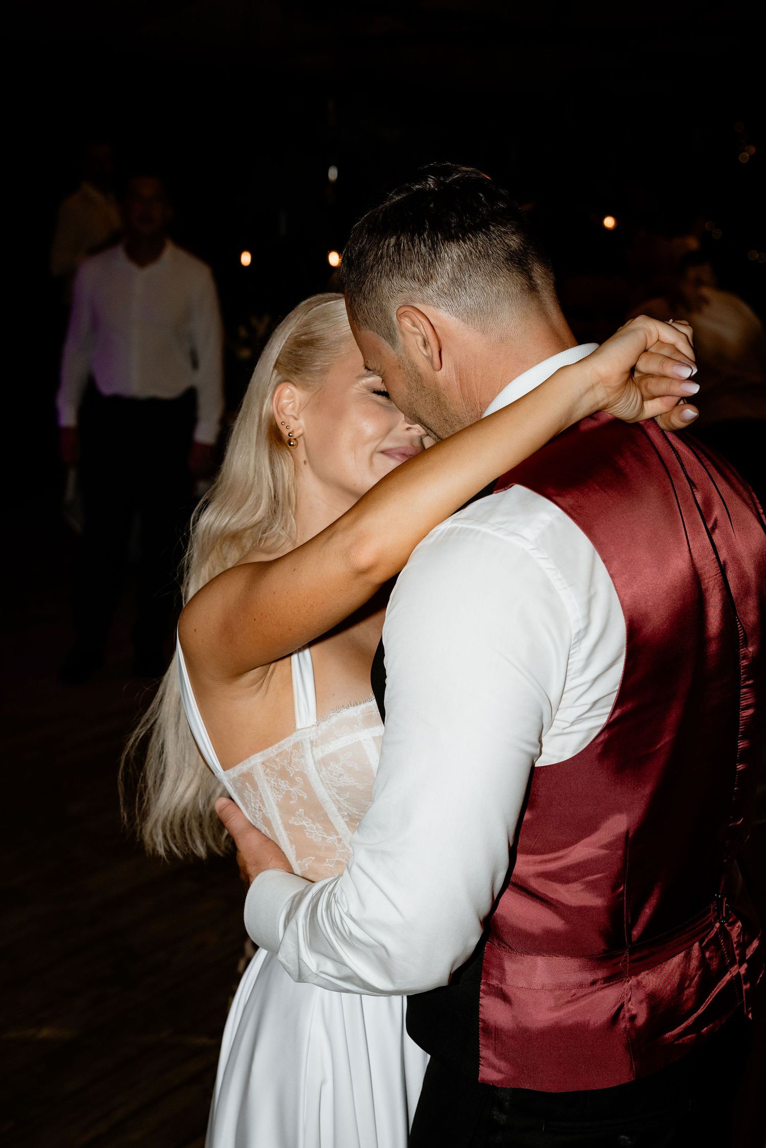 Dancing couple shares an intimate moment on the dance floor at their reception.
