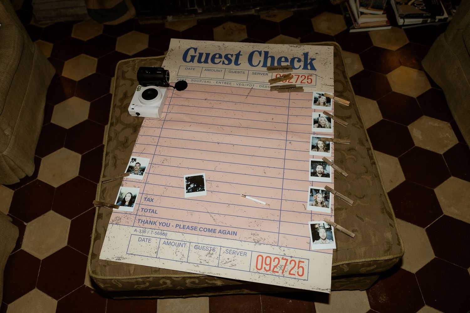 Guest check receipts laid out on a dark hexagonal patterned surface.
