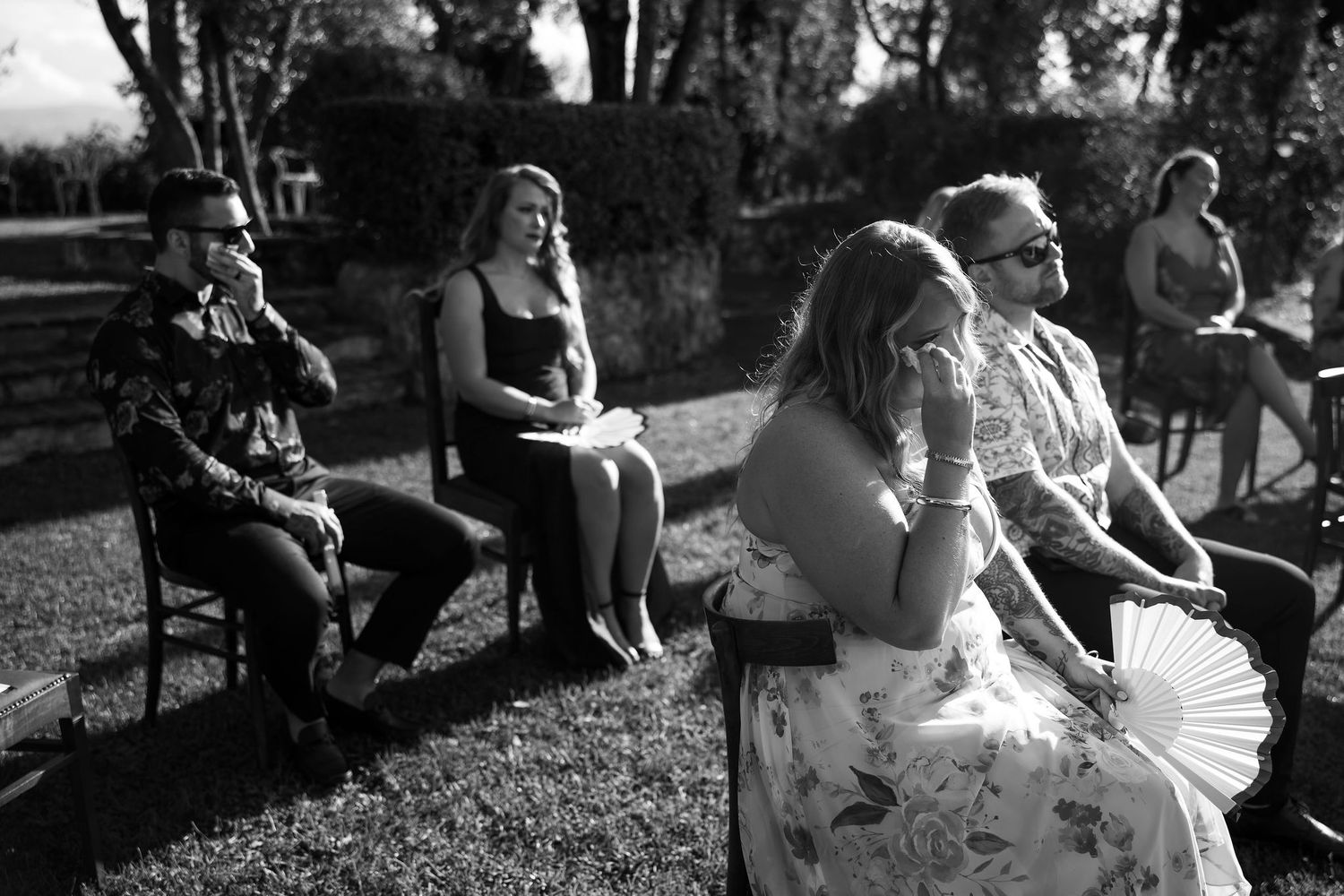 Black and white photo series showing a couple dancing together outdoors in a romantic sequence of movements.
