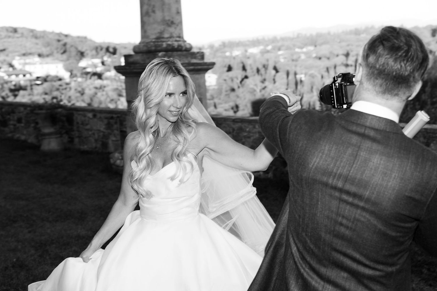 Black and white wedding photos showing candid moments of a bride and groom during their celebration.