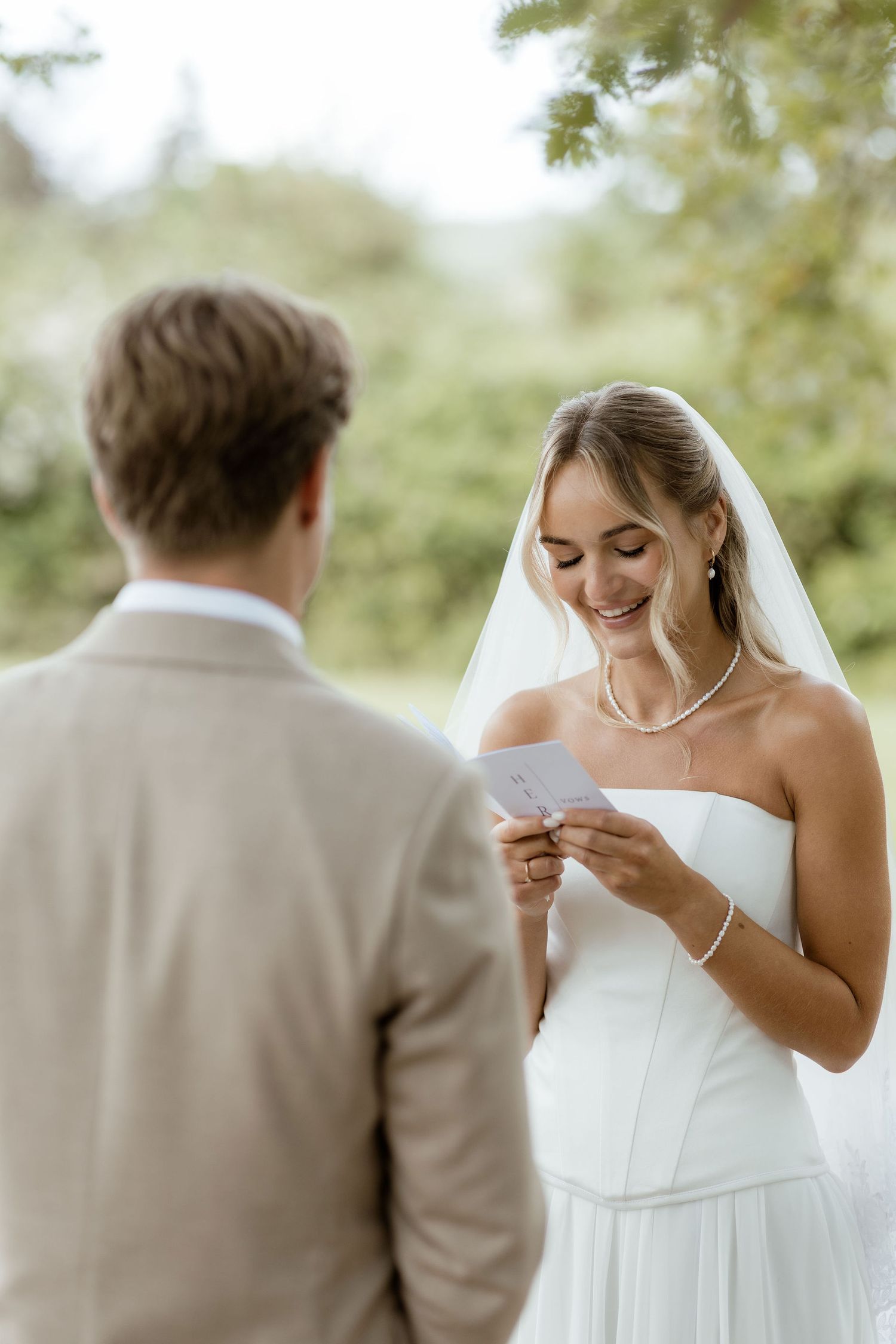 Emotional wedding moment captured in a sequence of five photos showing tender interaction between bride and groom outdoors.