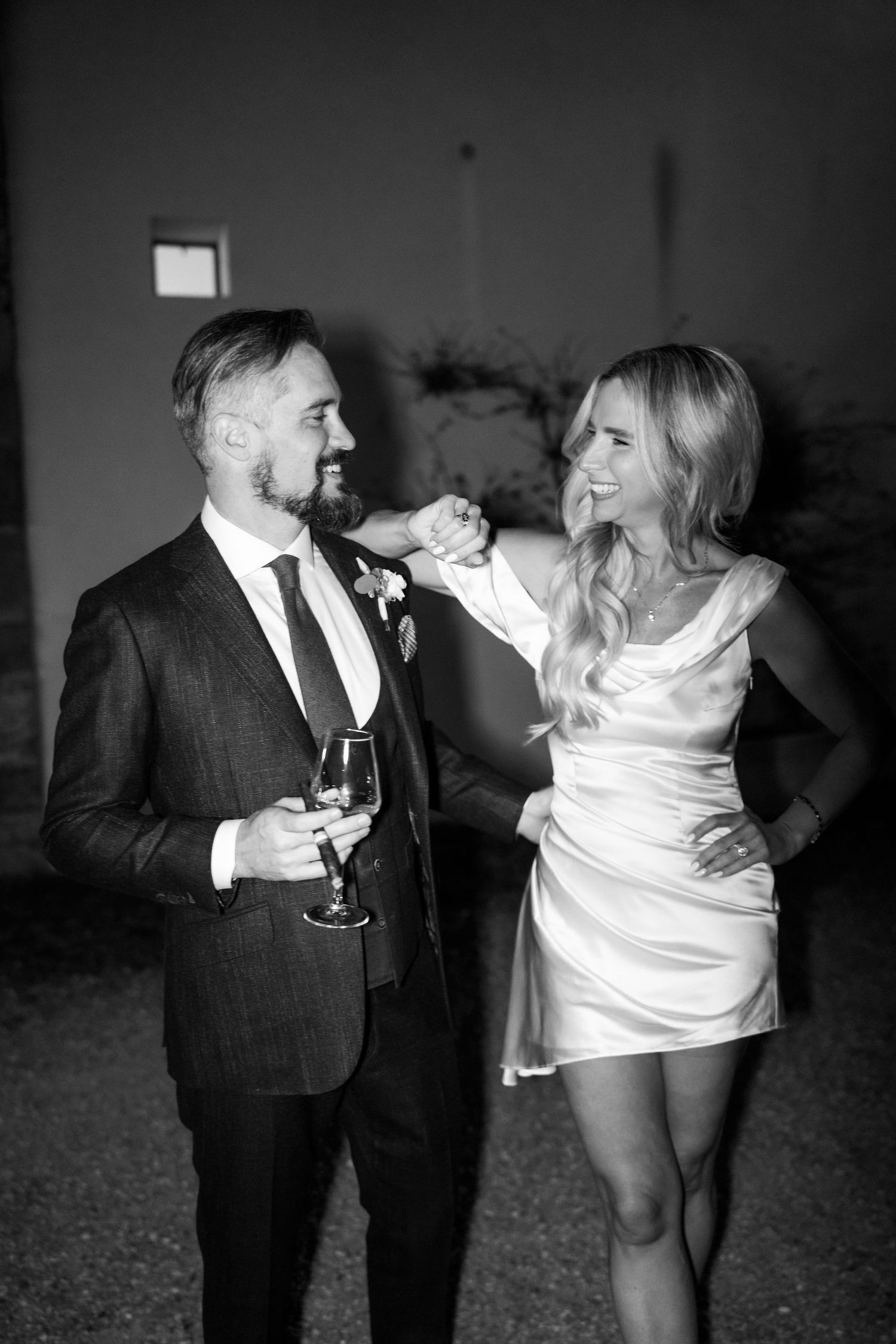 A black and white photo sequence shows a couple dancing and twirling together at a formal event.