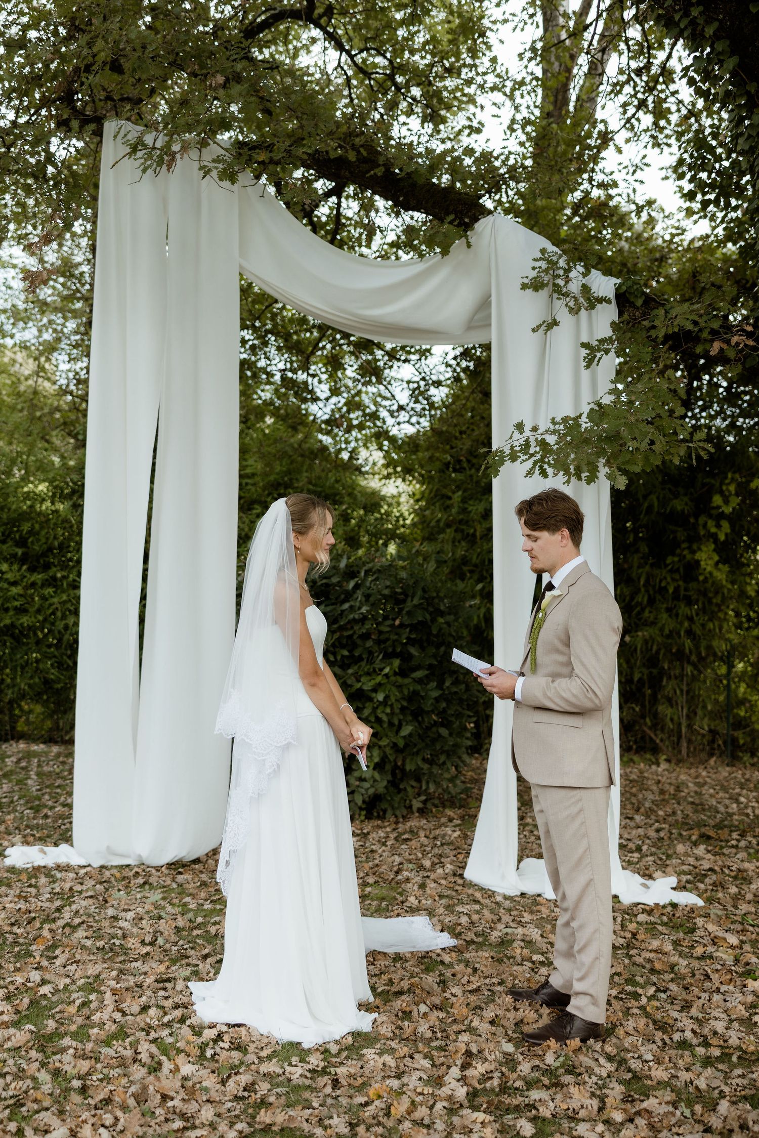 A romantic first look sequence of a bride and groom meeting before their outdoor wedding ceremony.