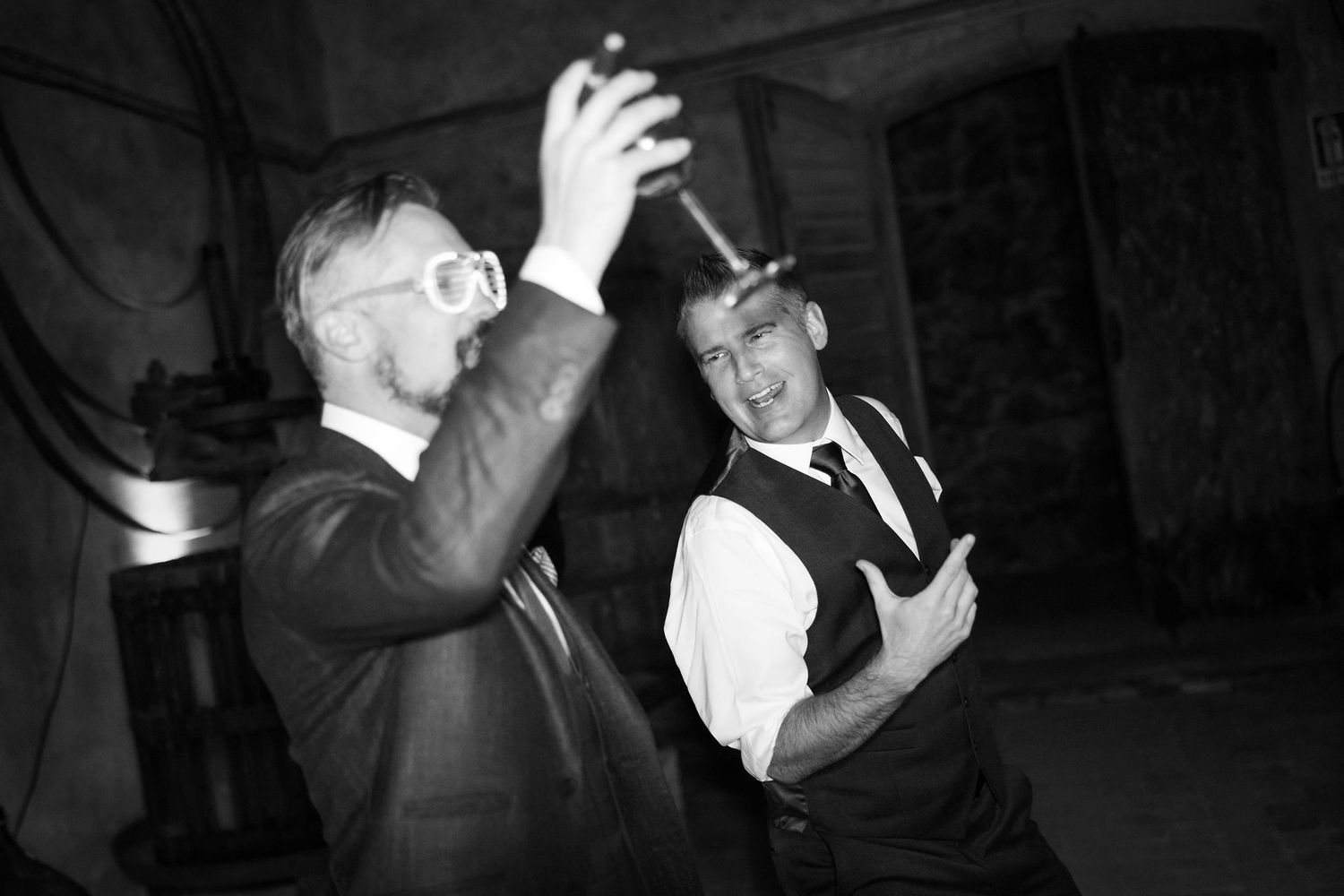 Black and white photo sequence showing a person dancing and spinning with dramatic movement and shadows.