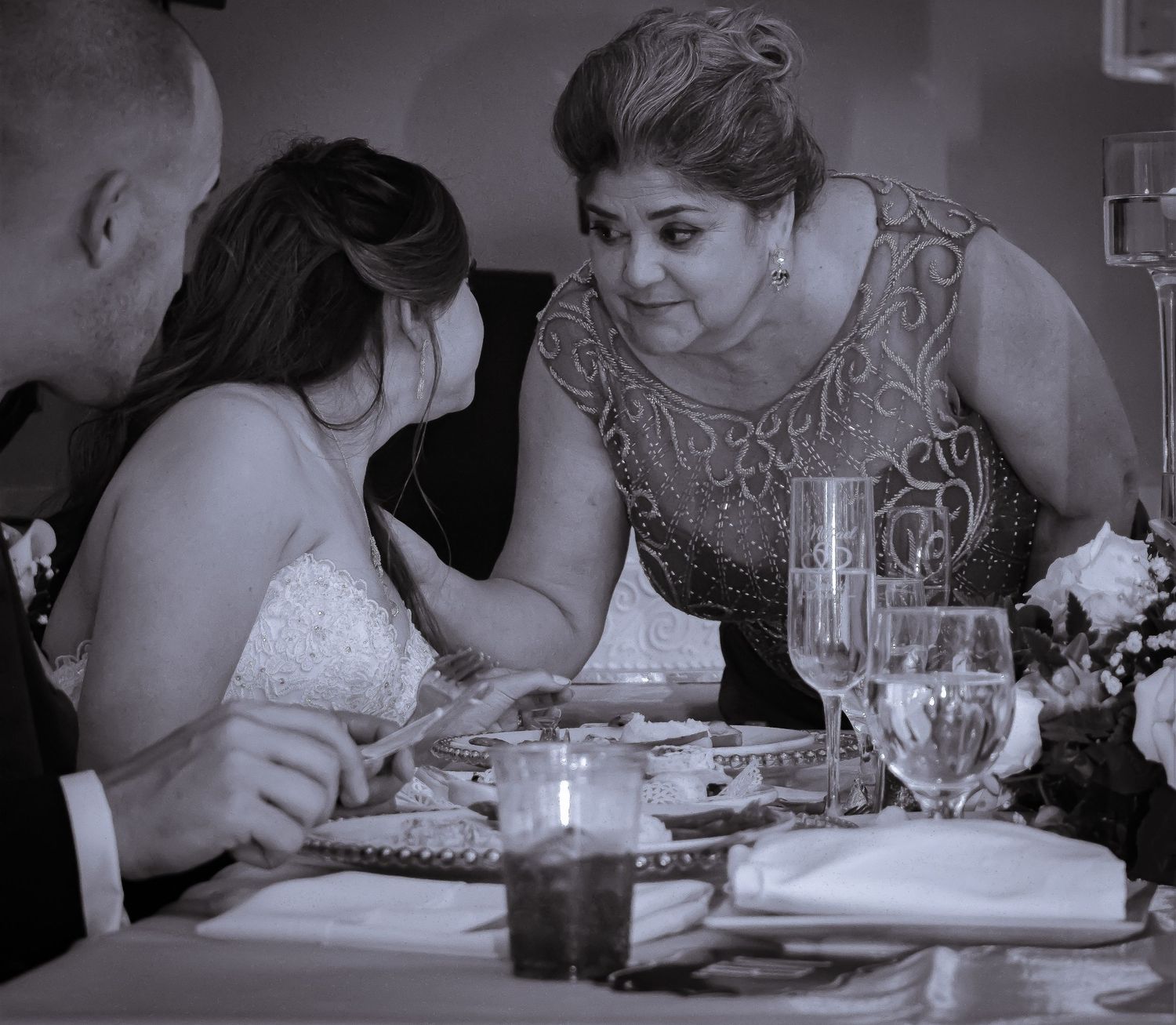 An intimate moment shared with mother during a reception dinner.