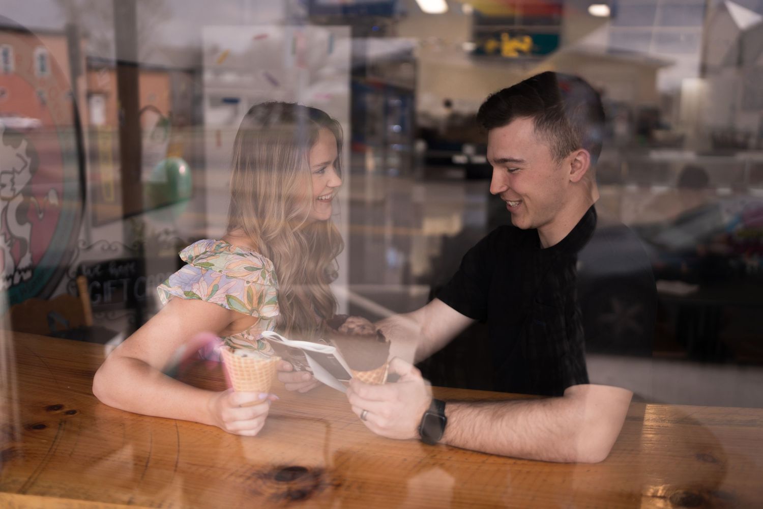 Ice cream shop pregnancy announcement photoshoot.