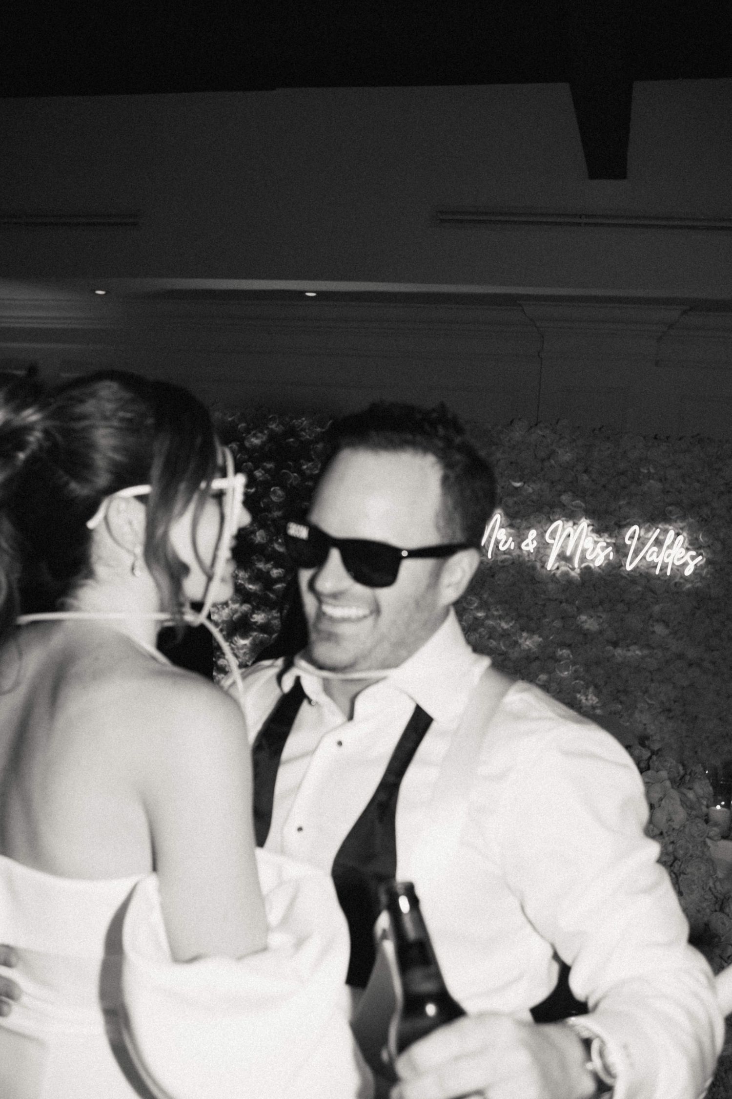 Black and white sequence of a couple sharing an intimate dance moment at their wedding celebration.