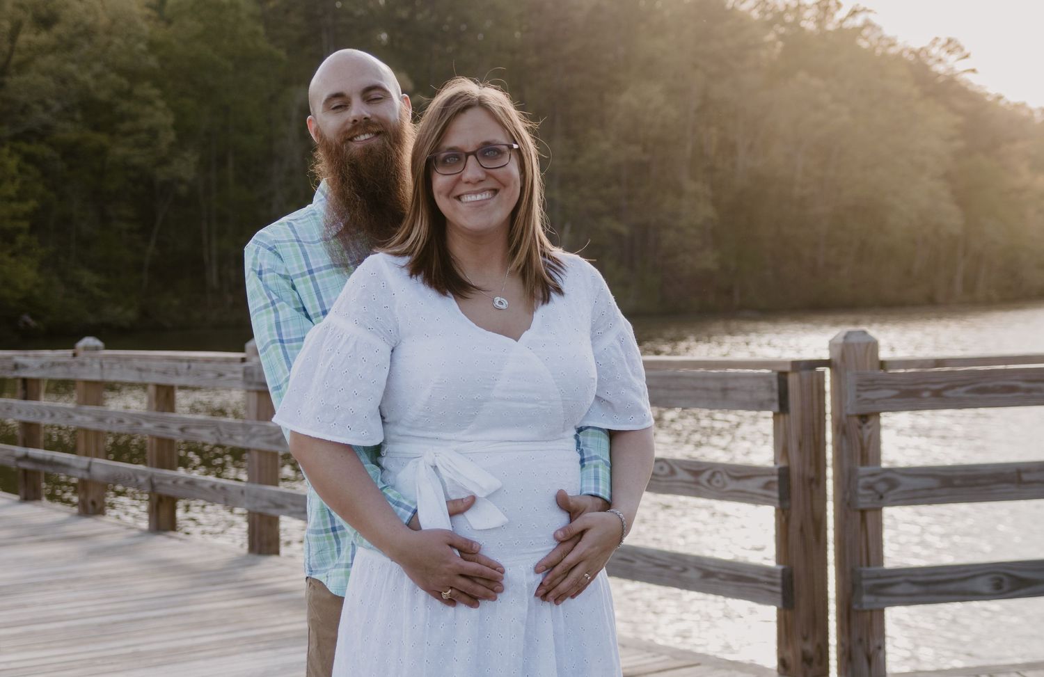 Romantic sunset portrait on a wooden boardwalk by Lake Toccoa in northeast Georgia.