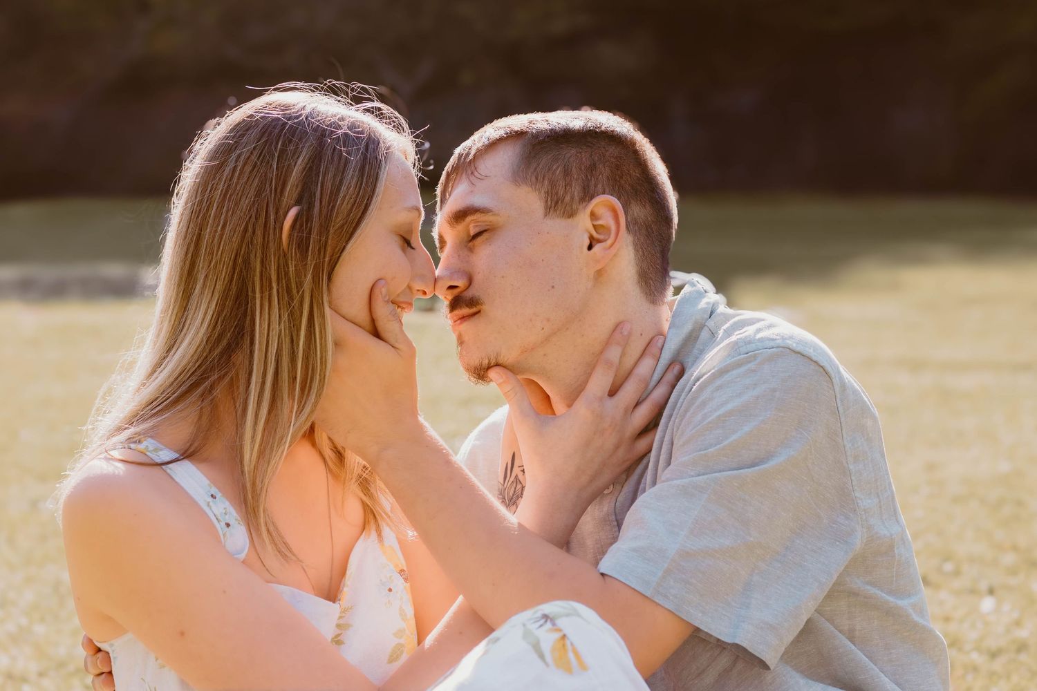 Intimate moment between couple during outdoor golden hour photography session at Henderson Falls Park in north Georgia.