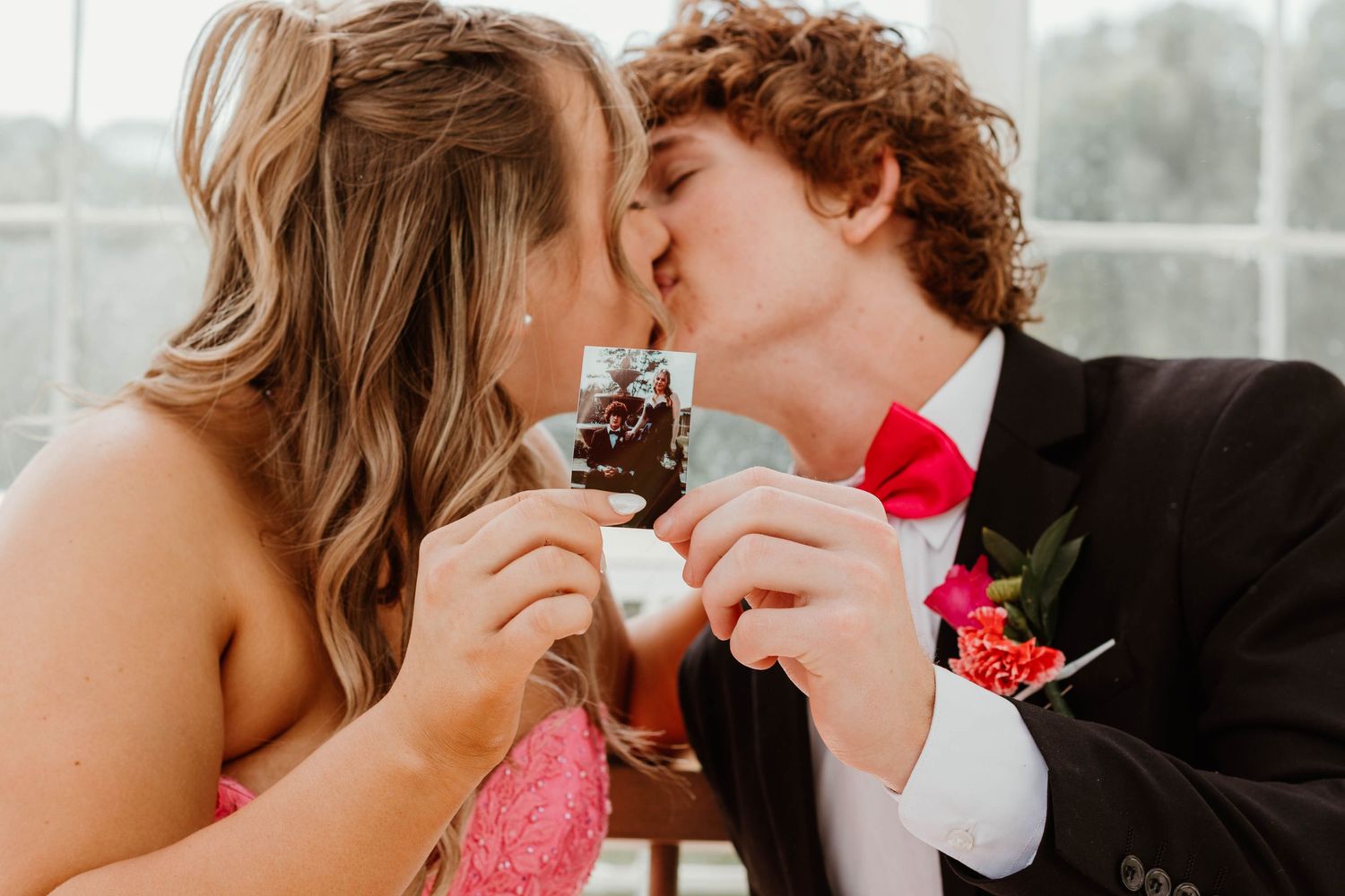 Romantic portraits in formal attire against bright sunlit windows at a greenhouse in Clarkesville, Georgia.