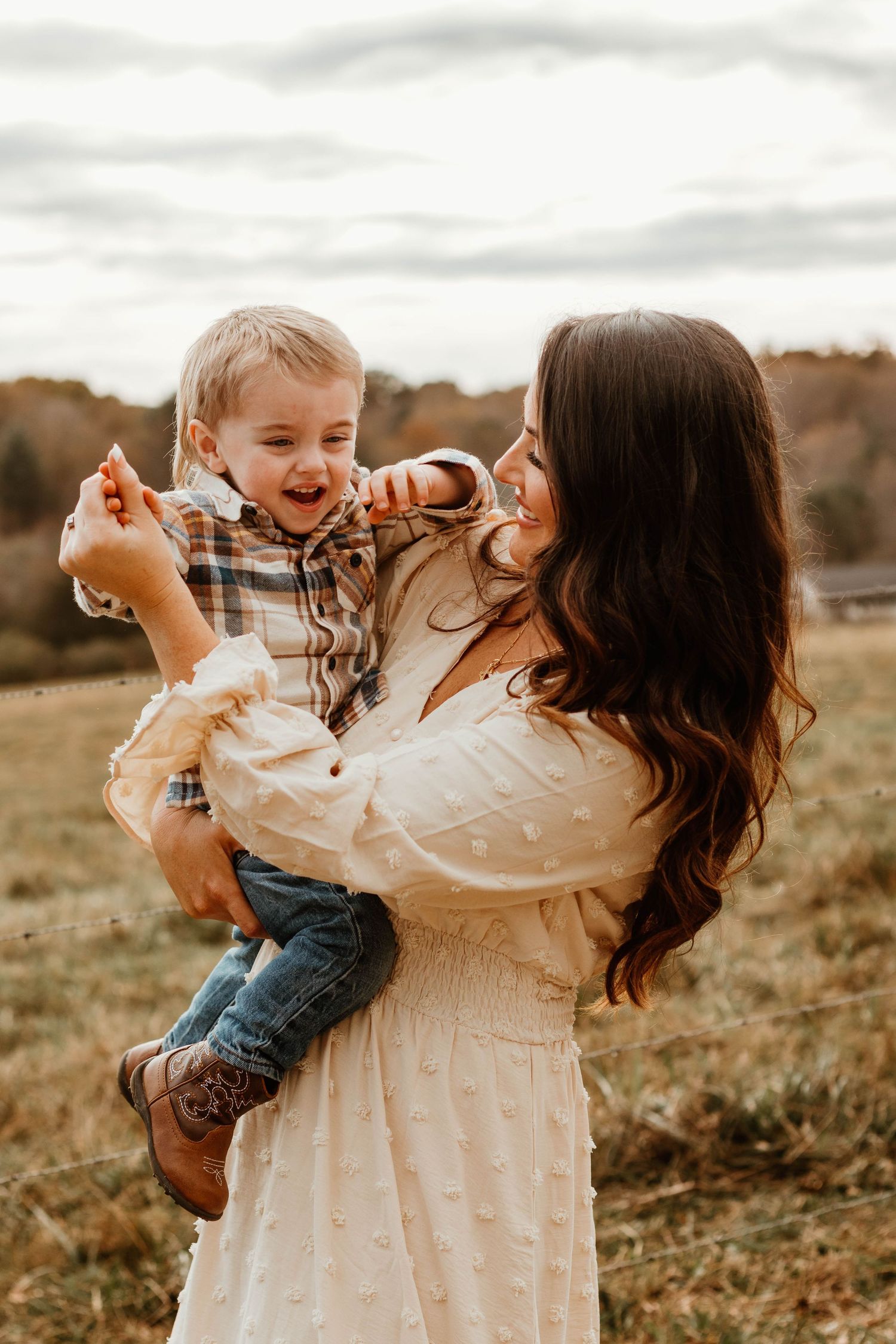 Dancing and twirling moments captured between parent and child in a rustic outdoor setting at The Farm at Daffodil Hill in Clarkesville, GA.