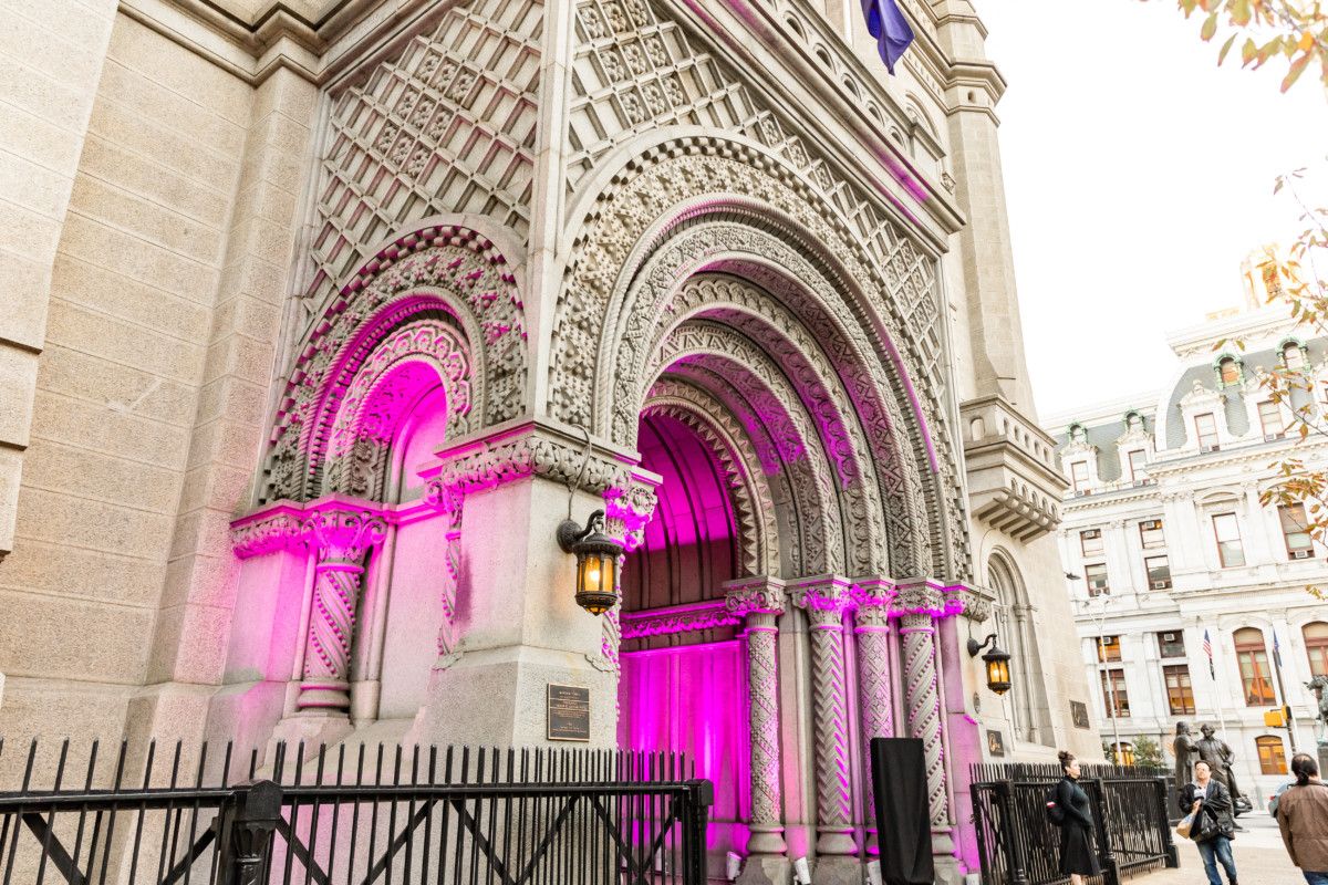 Outer entryway to ONE North Broad, lit up by pink lights
