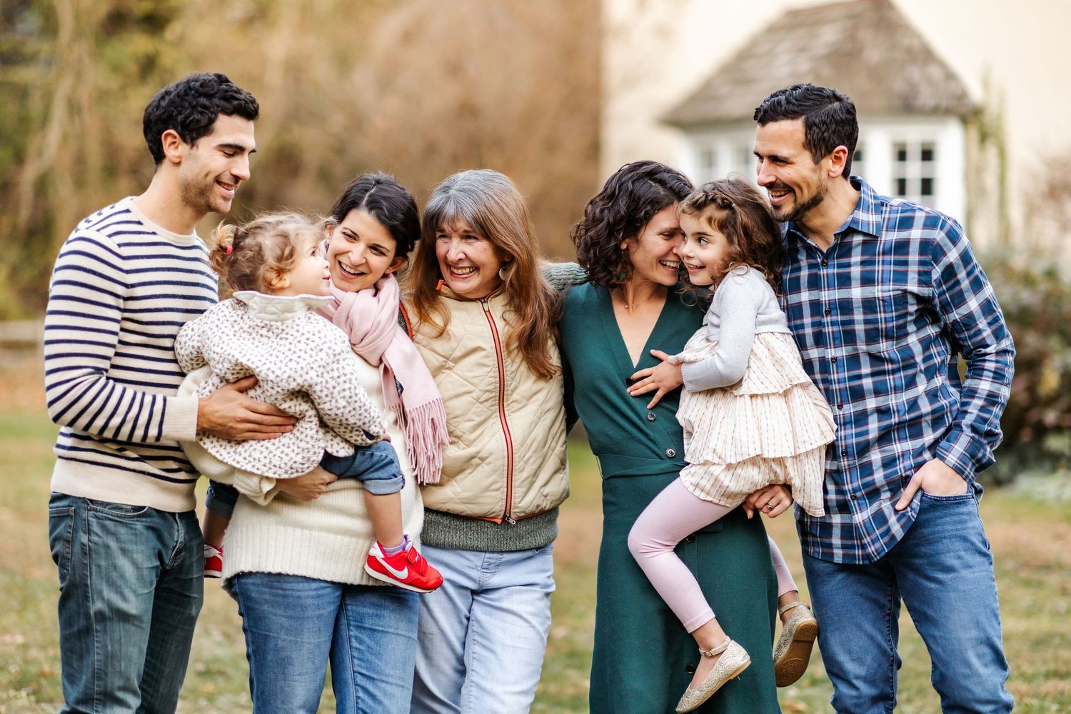 Extended family group enjoying time together outdoors on a casual afternoon.