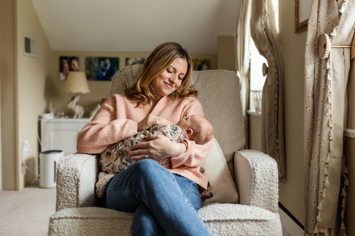 A quiet moment of bonding in a cozy living room armchair.