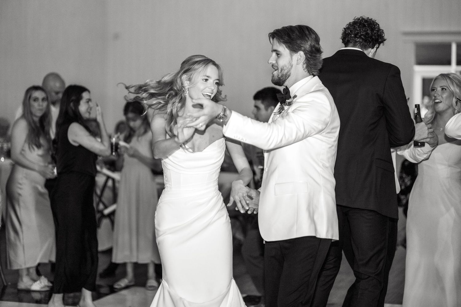 Bride and groom dancing together during wedding reception at Chandelier Farms
