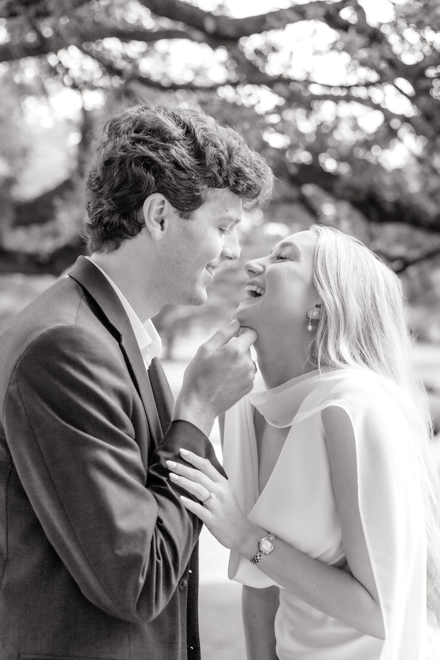 engaged couple going in for a kiss at their luxury Dallas, Texas engagement photo session