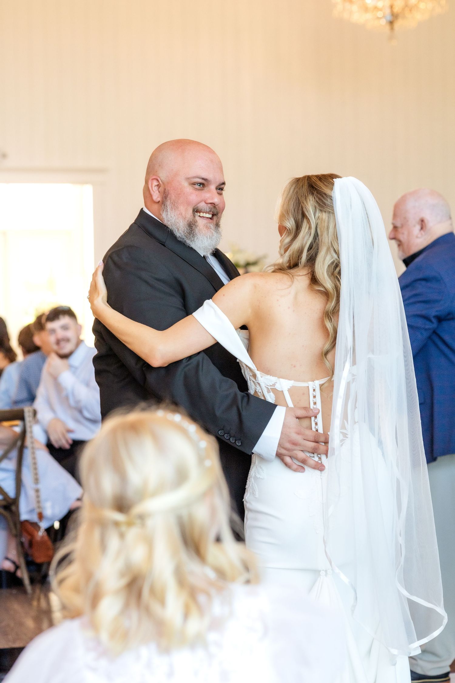 Bride and her brother dancing together at Dallas Spring wedding reception