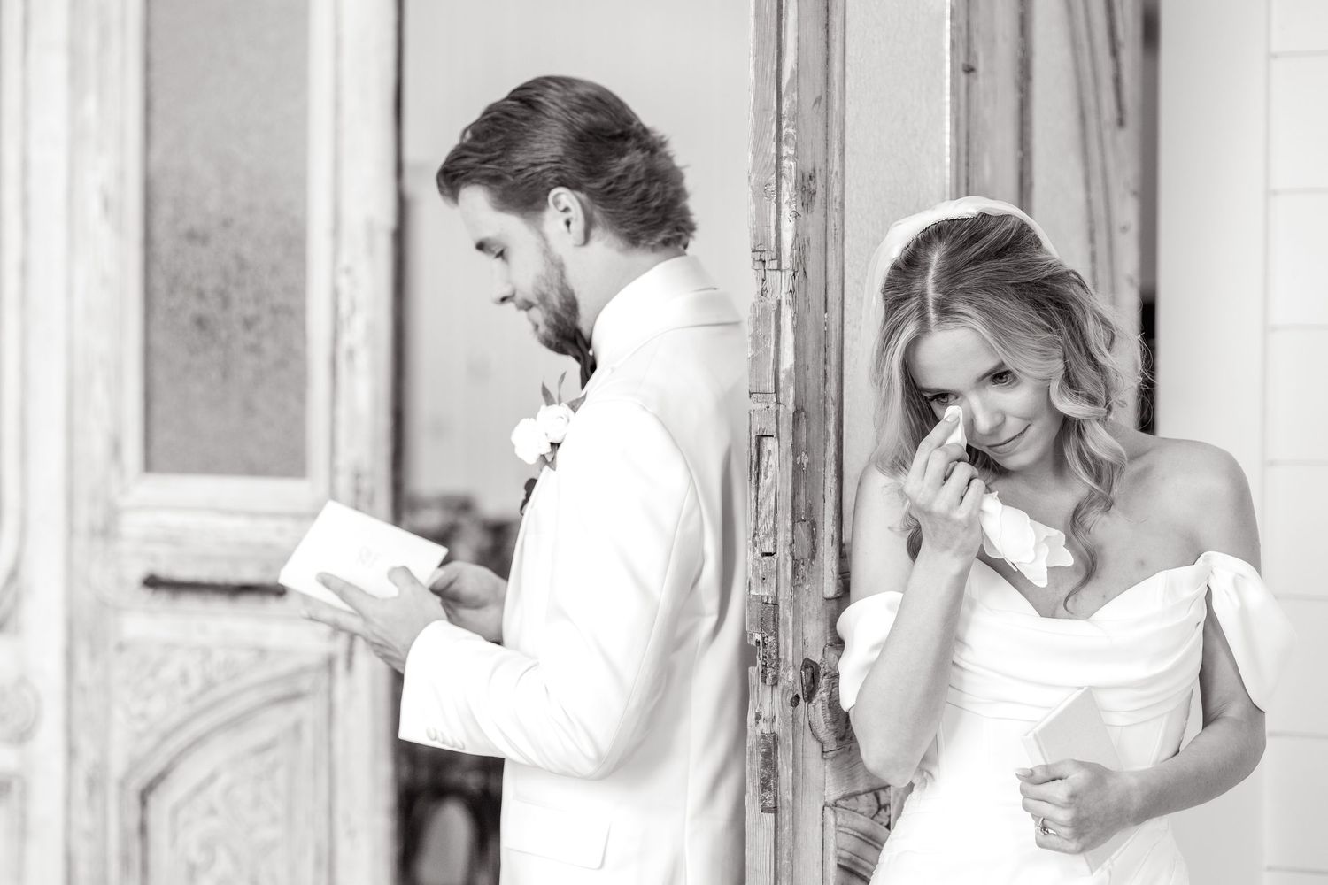 Groom reading his wedding vows privately to his bride as she tears up and dries up her tears using a handkerchief at Dallas wedding