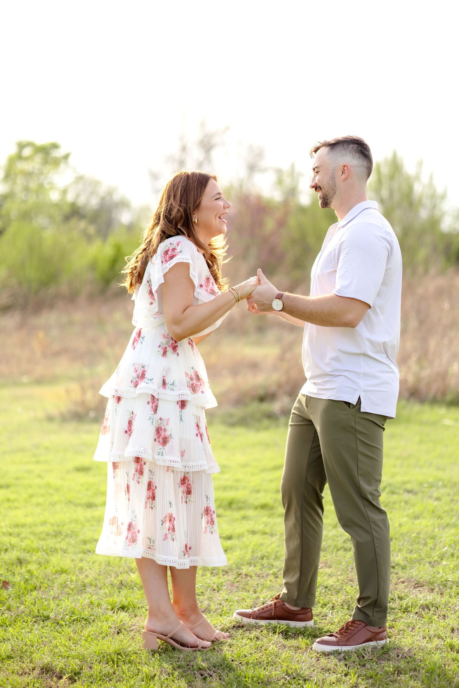 married couple holding hands and laughing at couples photo session in Dallas, Texas