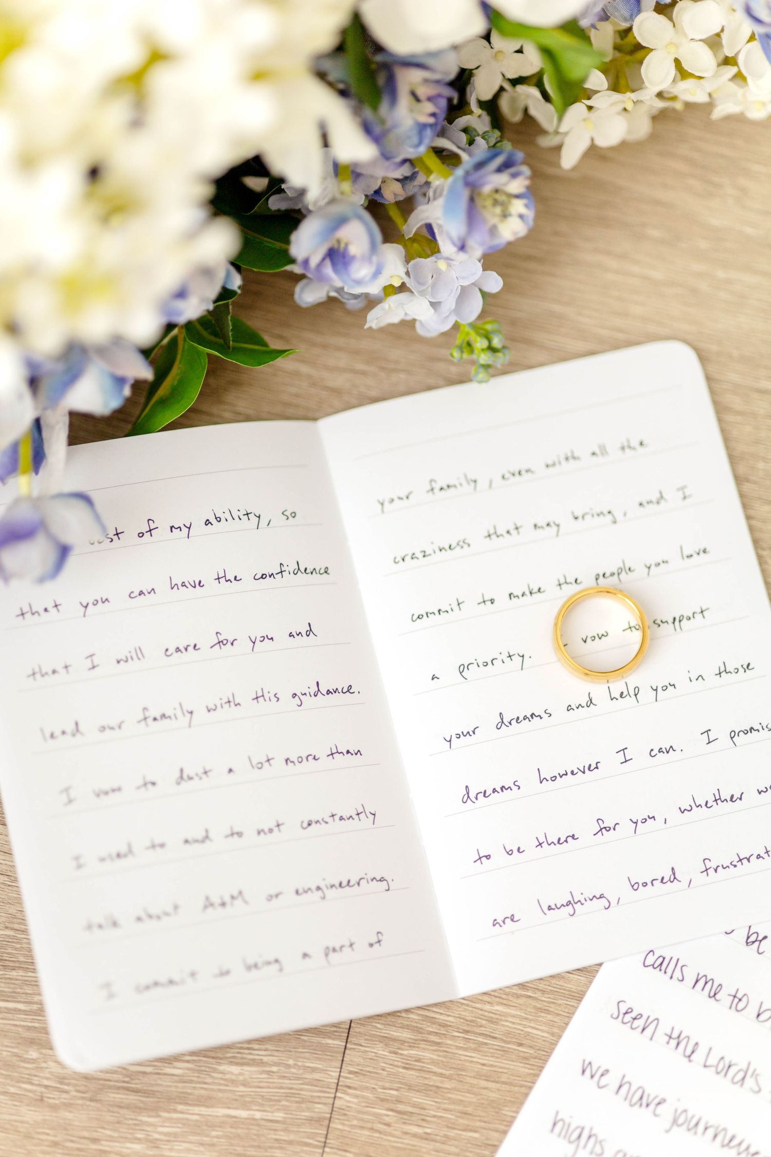 Wedding vow books with the wedding rings and bridal bouquet dallas wedding photographer texas