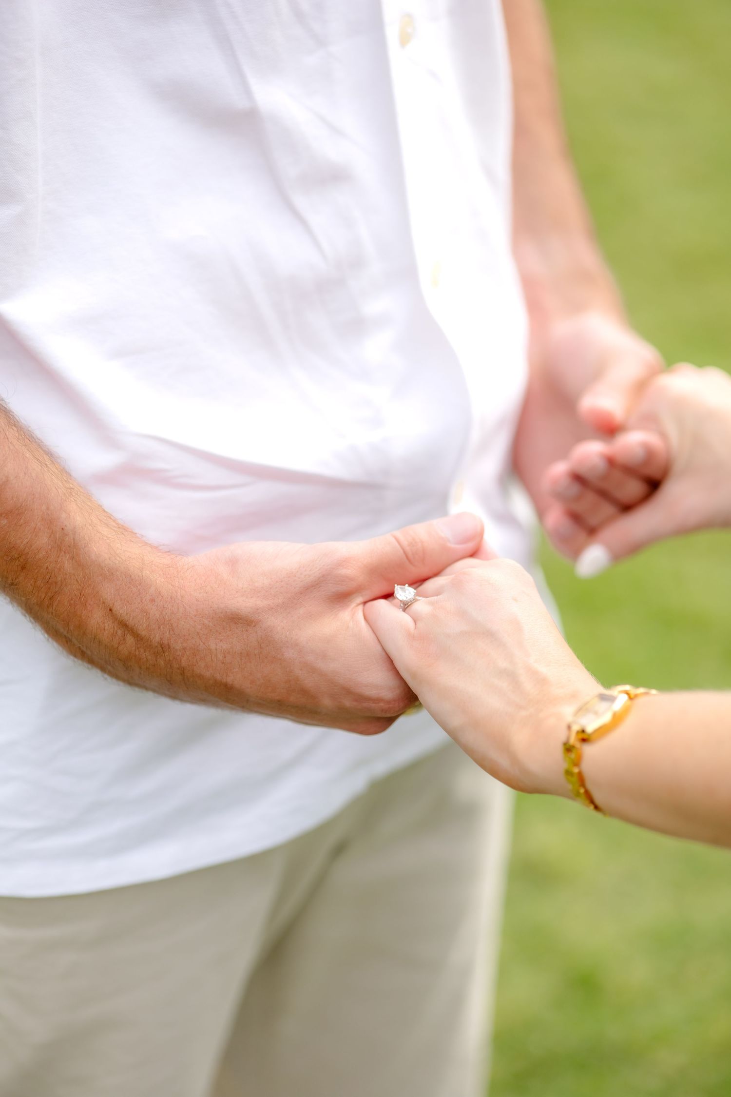 Engaged couple holding hands at Flippen Park in Dallas, TX