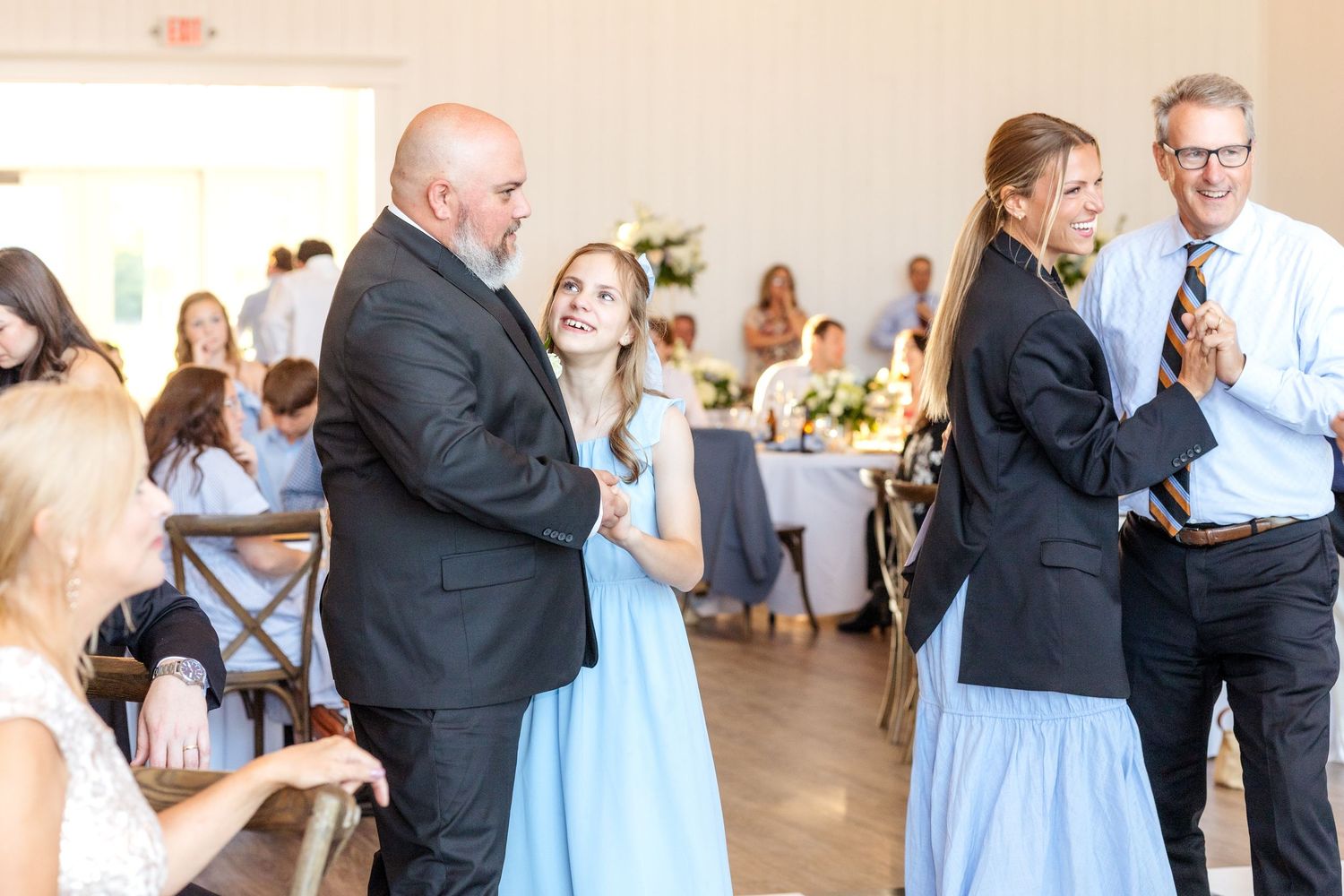 Dads dancing with their daughters during a wedding reception in Dallas at Chandelier Farms