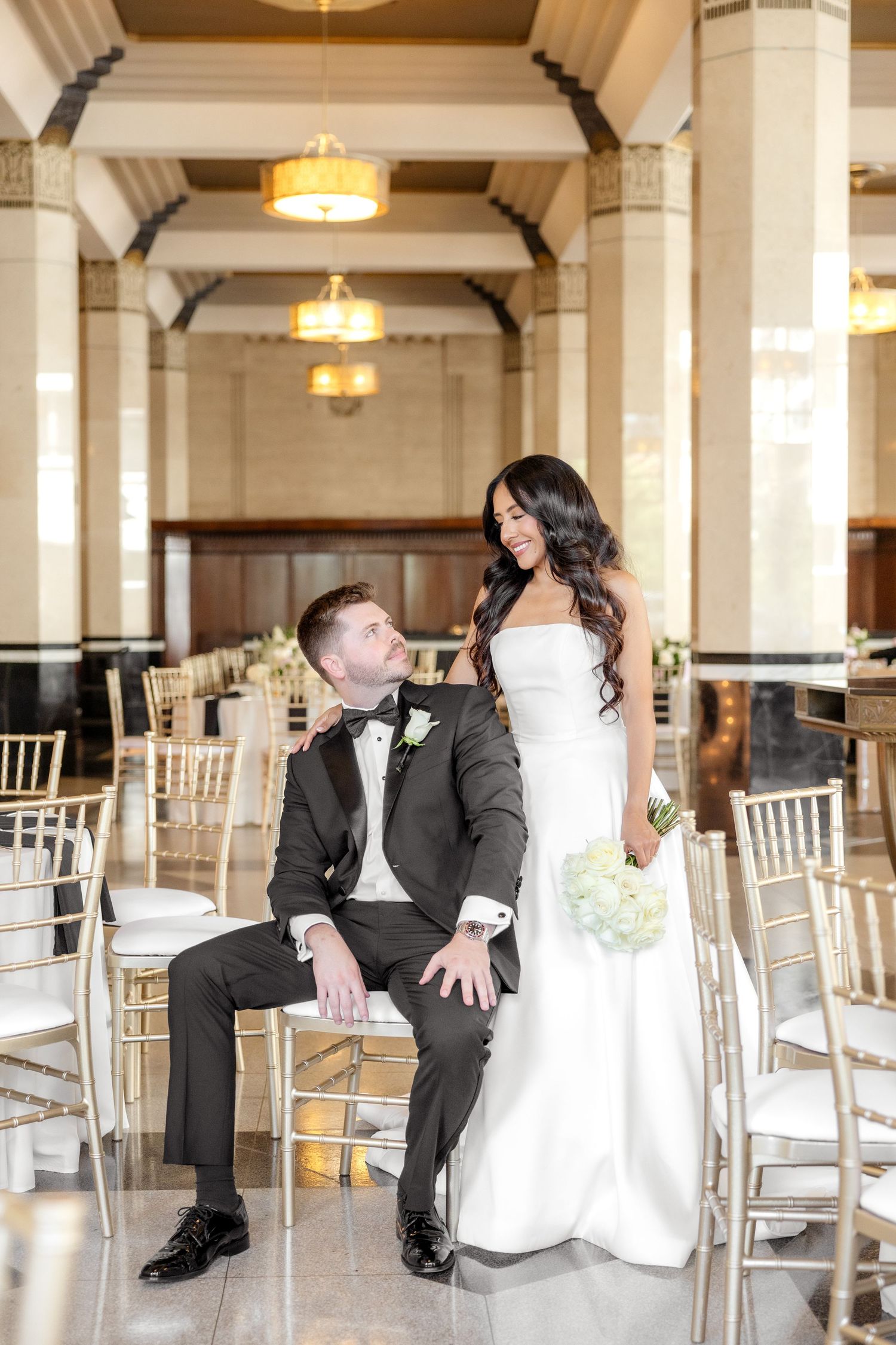 Bride and groom looking at one another at The Carlisle Room at classy and elegant Dallas wedding reception