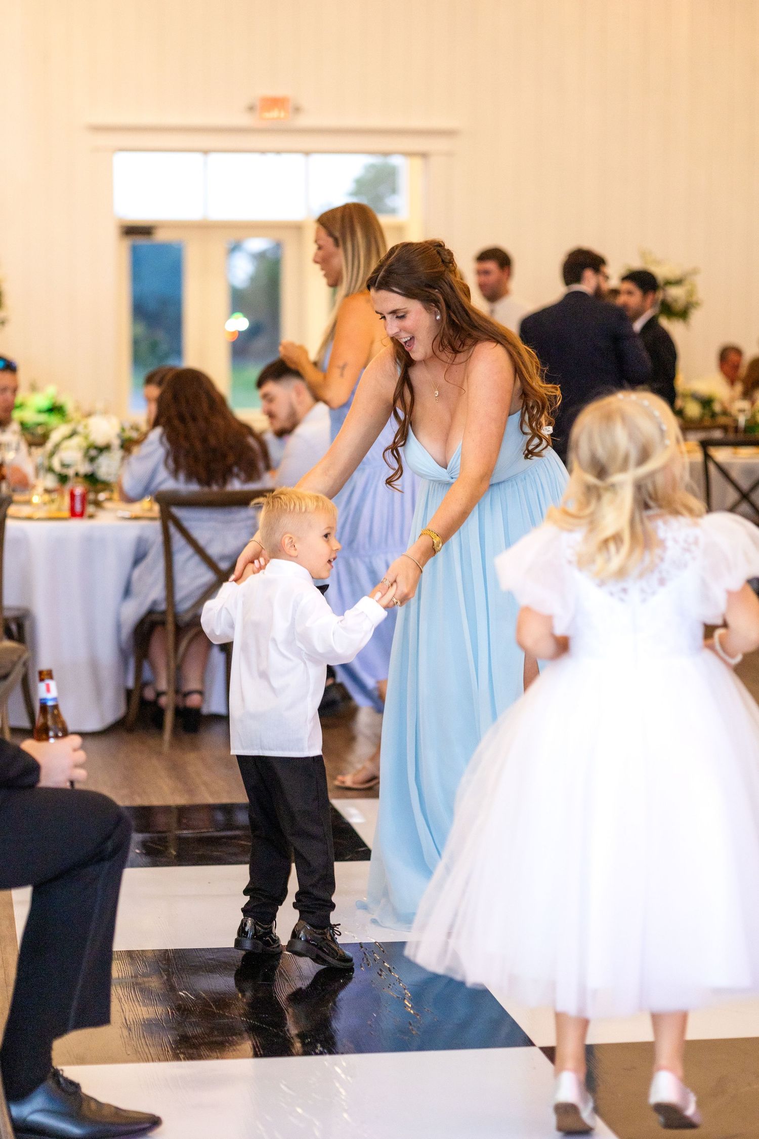 Little boy and his mom dancing together at Dallas wedding reception