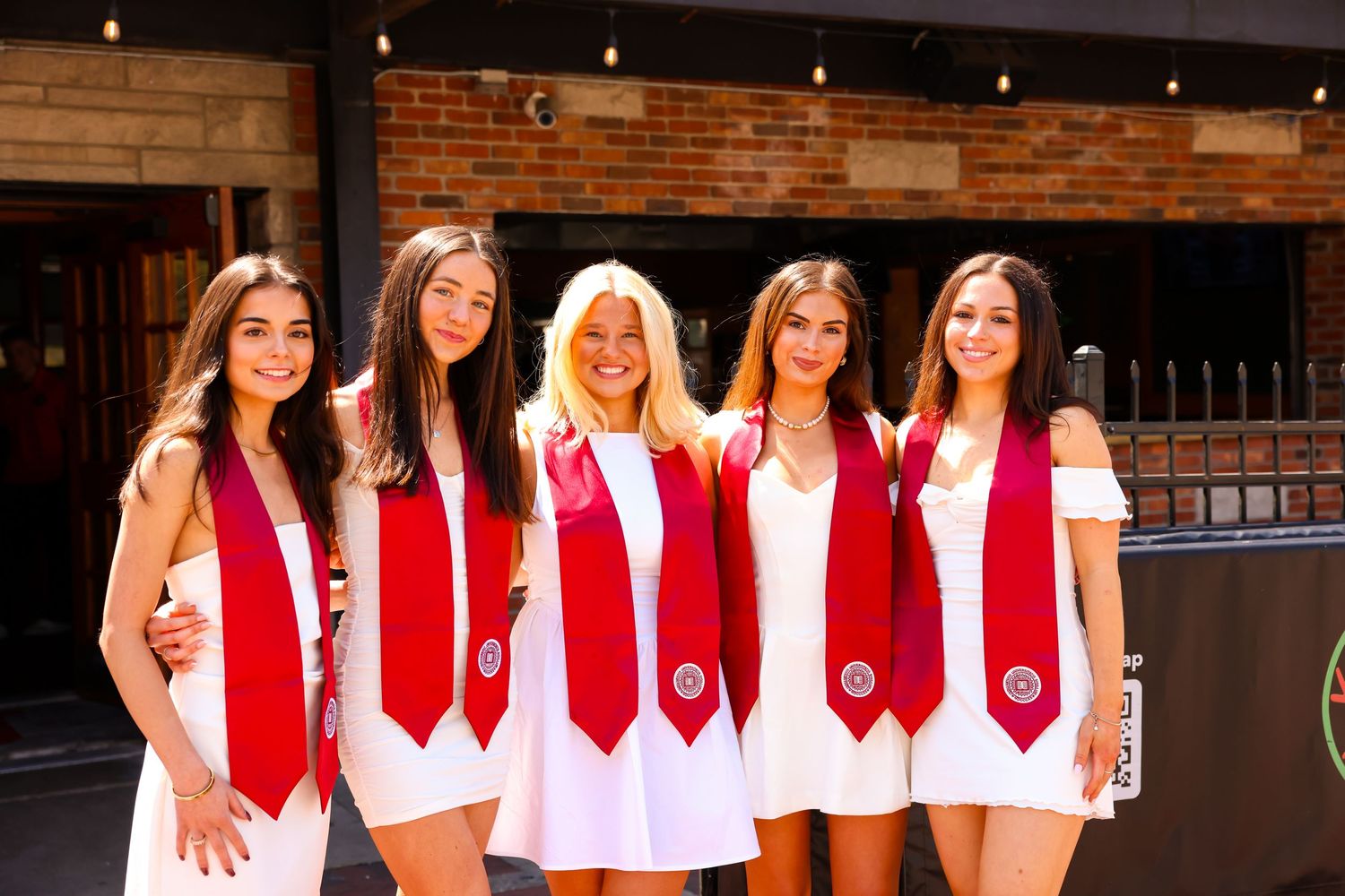 5 graduating women from Indiana university standing in front of Kilroys bar