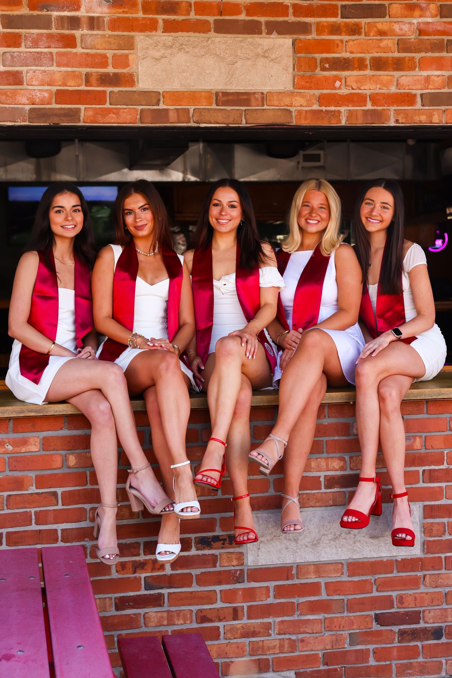 5 graduating women from Indiana university sitting on Kilroys bar