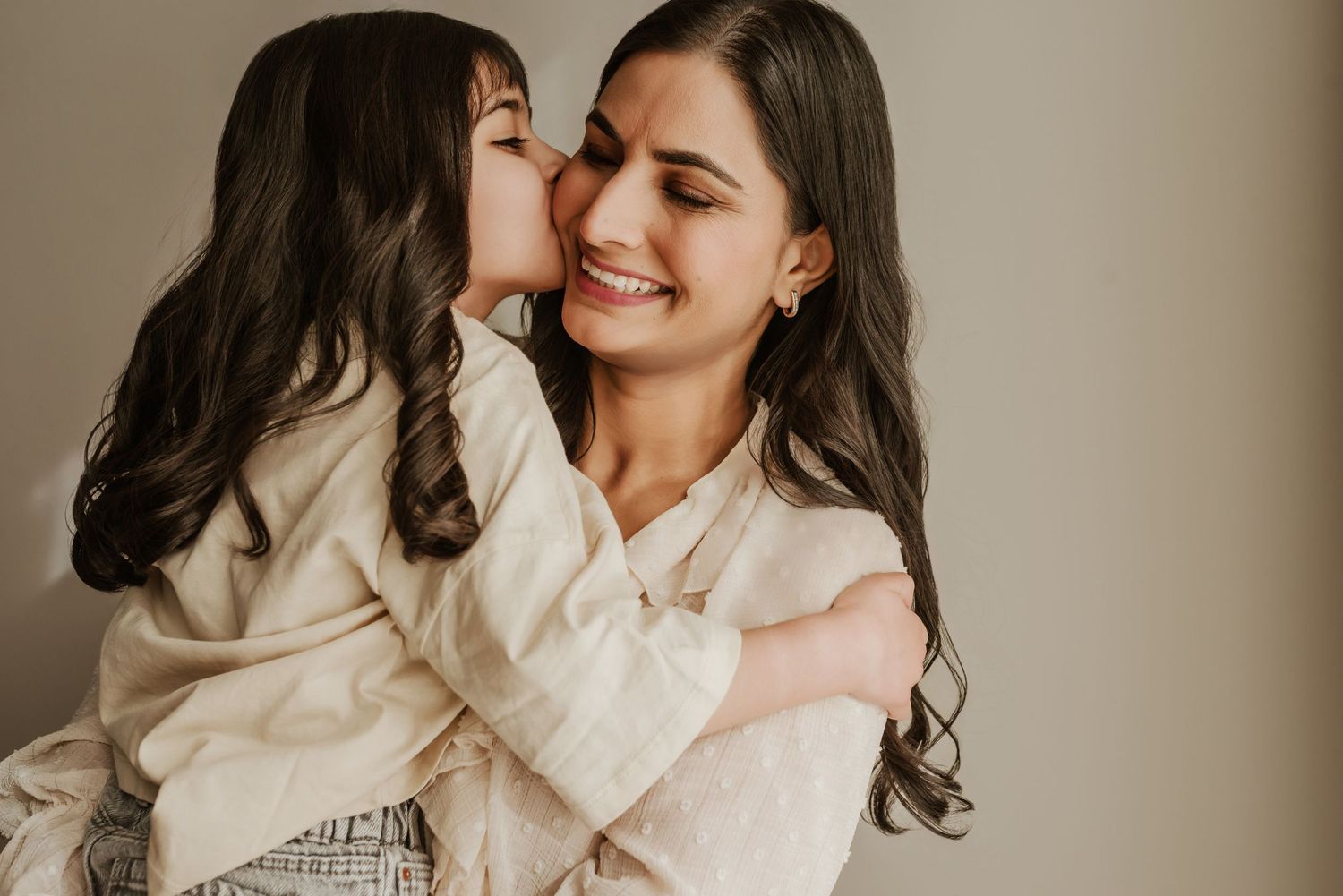 Family photography session in Edmonton, Alberta, capturing parents and children enjoying light-filled portraits.