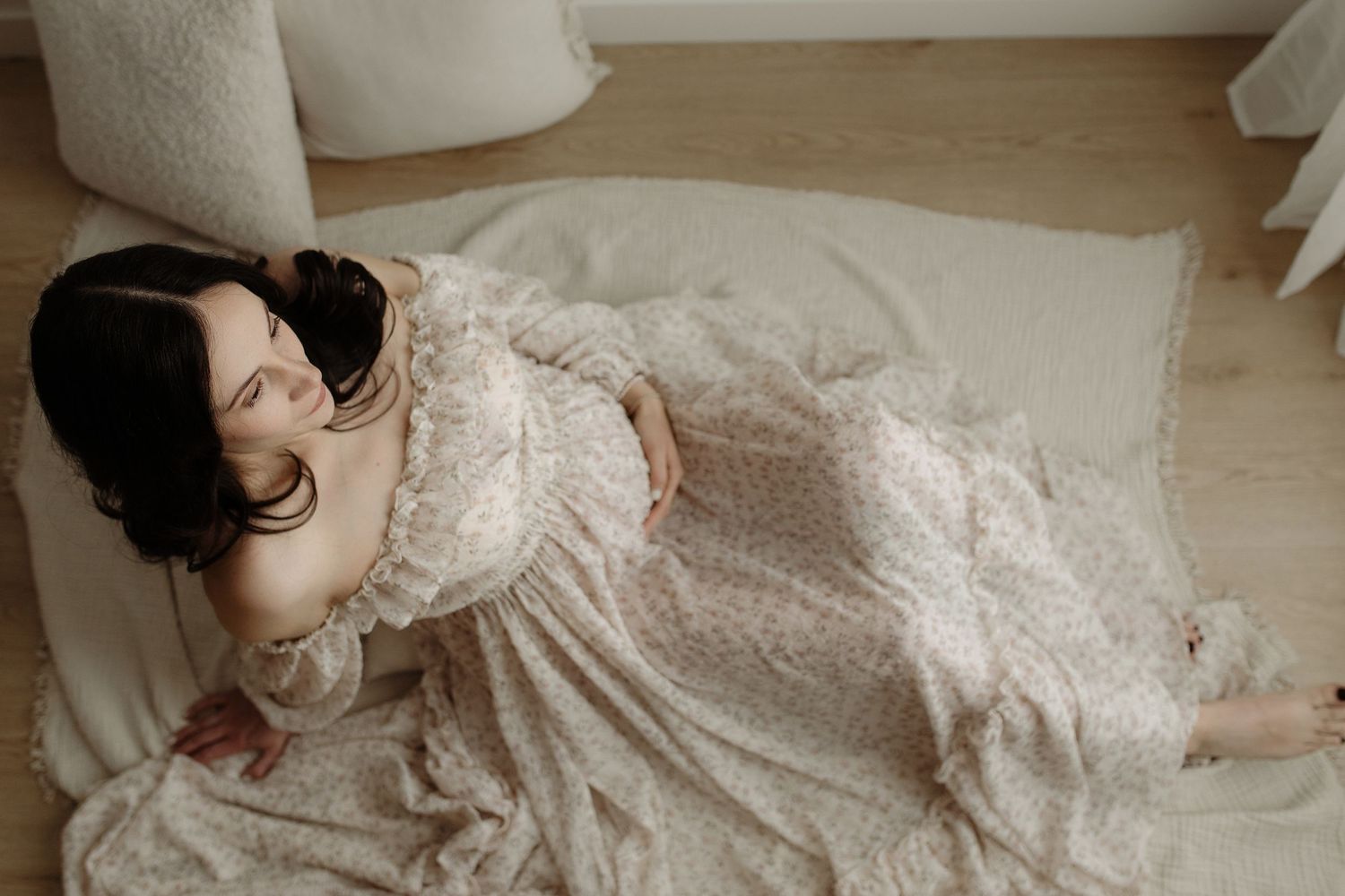 Studio maternity portrait of expecting mother in Edmonton, Alberta, showcasing elegant and timeless pregnancy photos.