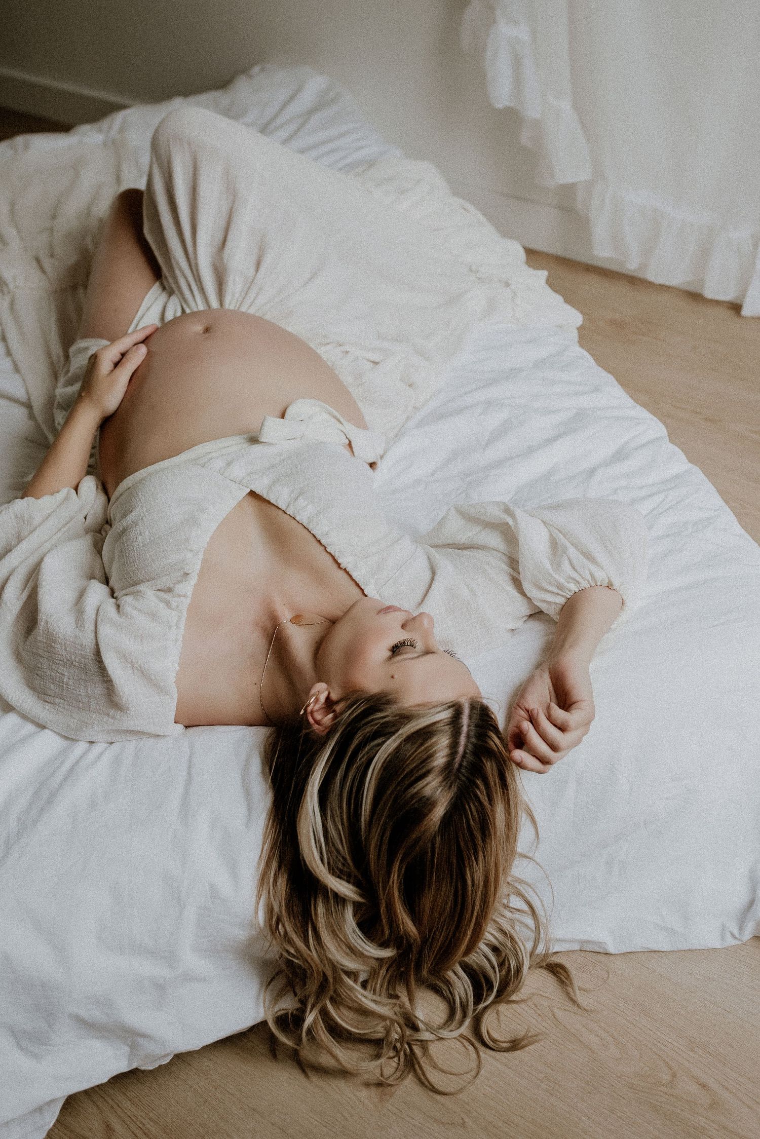 Studio maternity portrait of expecting mother in Edmonton, Alberta, showcasing elegant and timeless pregnancy photos.