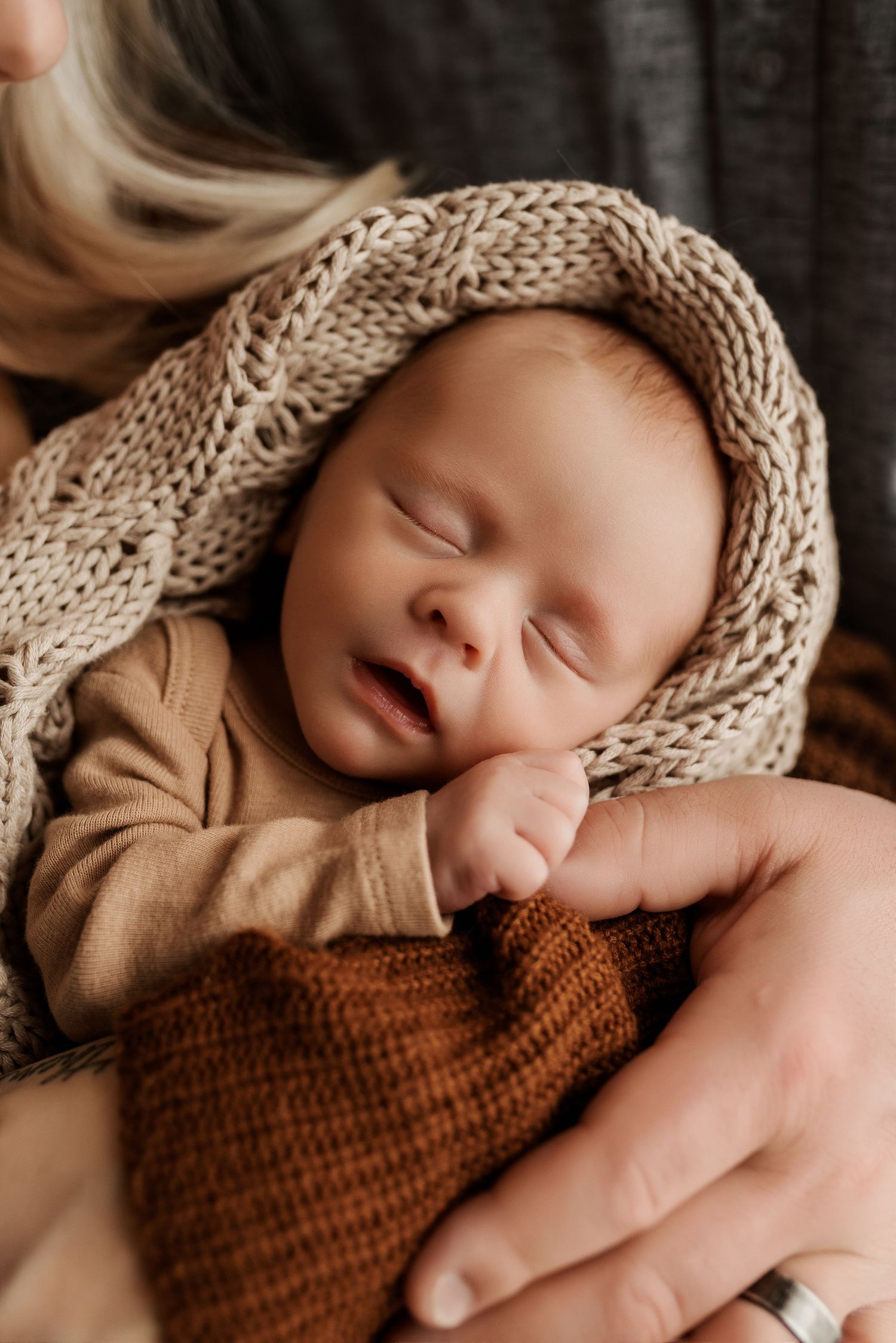 Close-up of newborn hands and feet in Edmonton studio, showcasing professional newborn photography style.