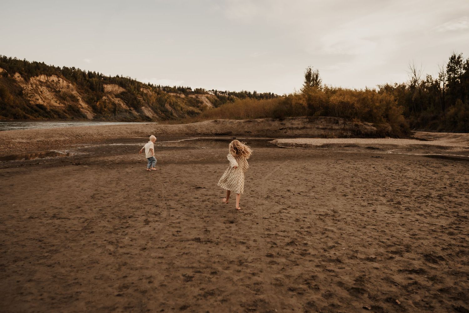 Family photography session in Edmonton, Alberta, capturing parents and children enjoying light-filled portraits.