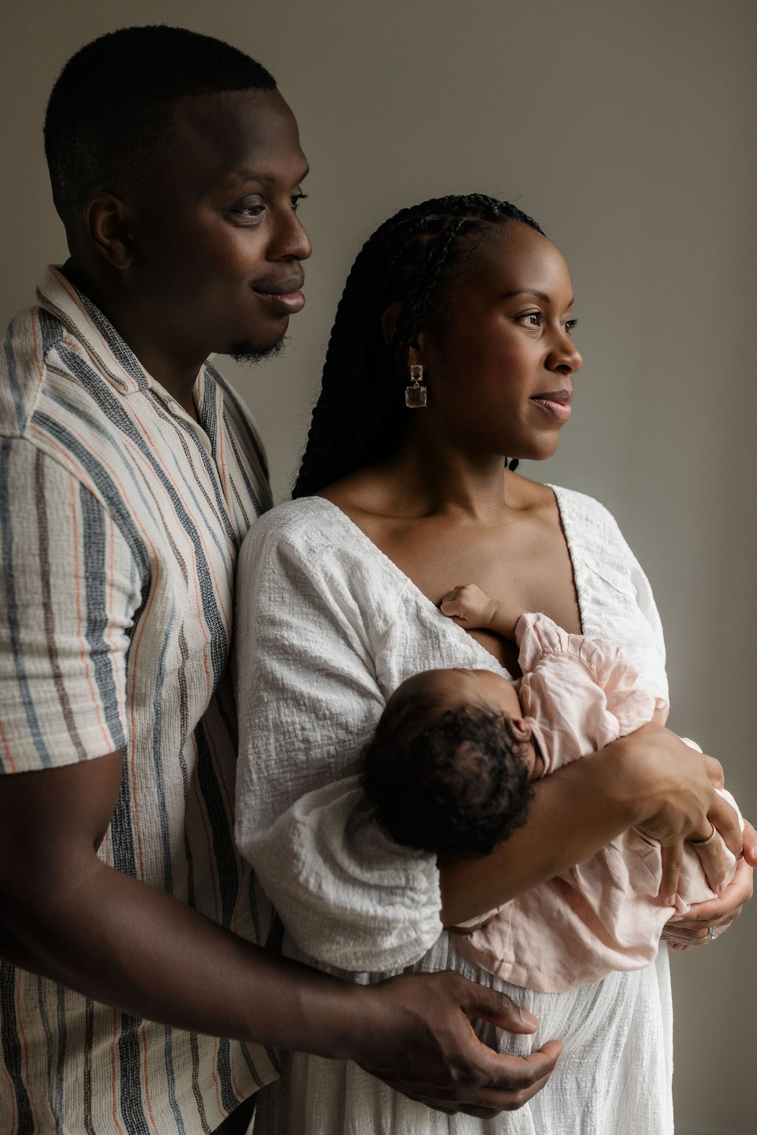 Close-up of newborn hands and feet in Edmonton studio, showcasing professional newborn photography style.