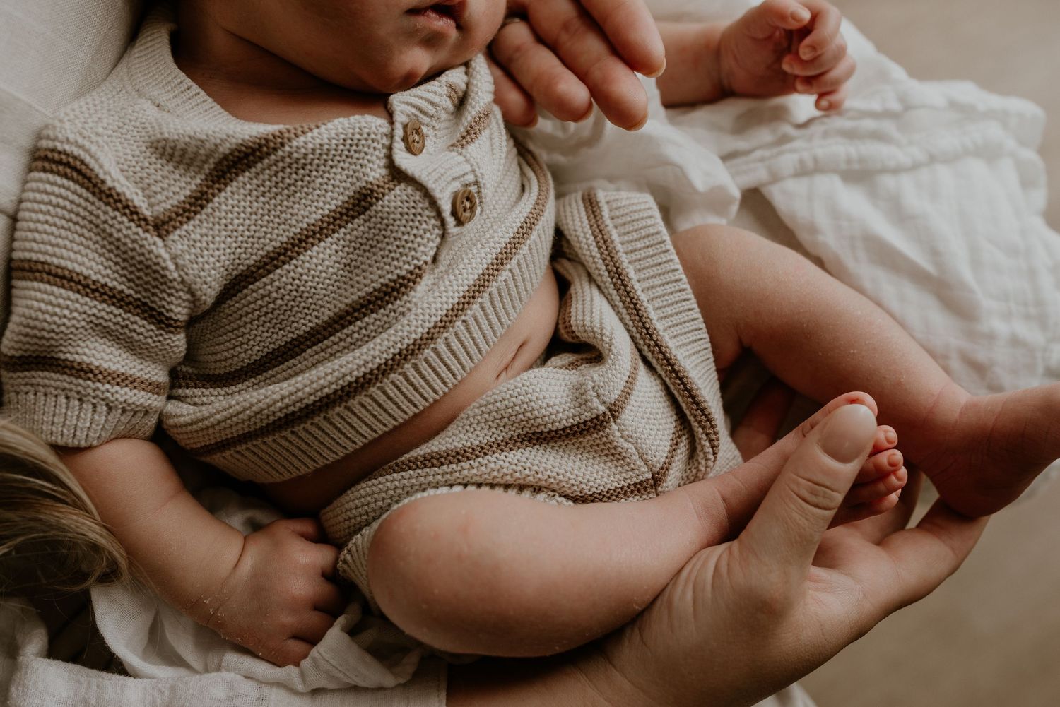 Studio newborn photography session in Edmonton, Alberta, capturing tiny details and family memories.