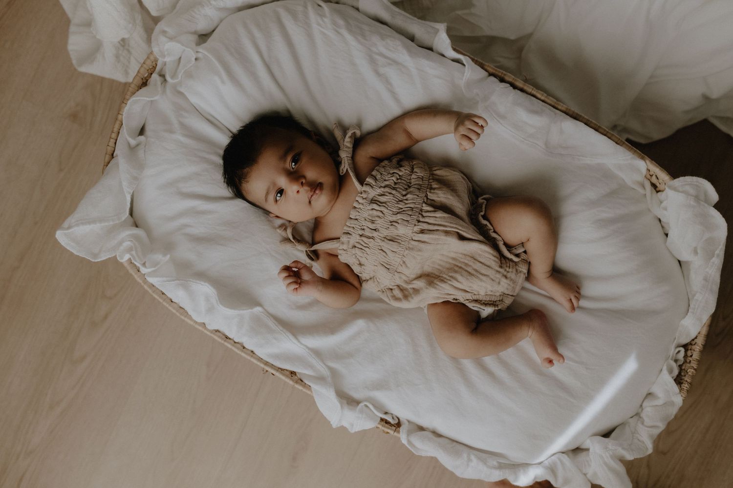 Newborn in studio photography session in Edmonton, Alberta, capturing peaceful early life moments.