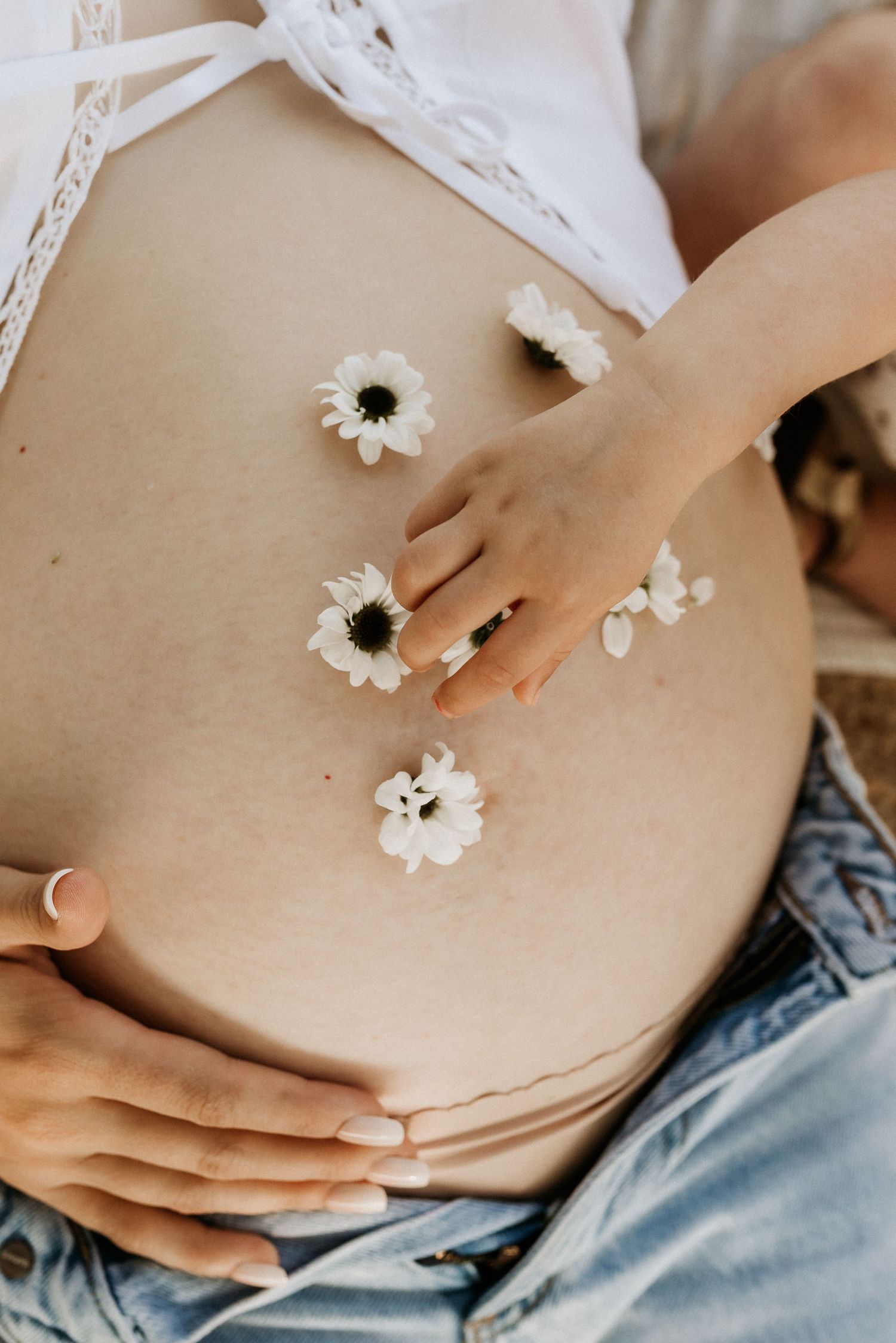 Edmonton maternity photography session of pregnant woman in soft natural light, capturing her pregnancy glow.