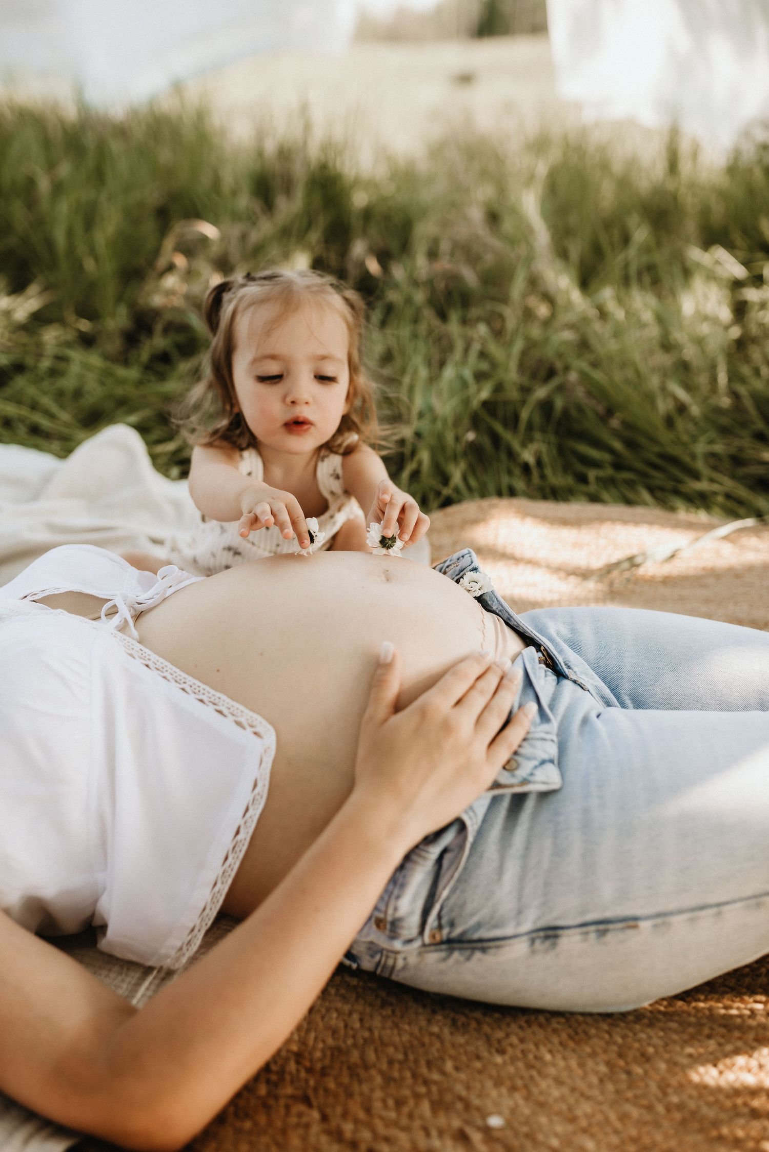 Edmonton maternity photography session of pregnant woman in soft natural light, capturing her pregnancy glow.